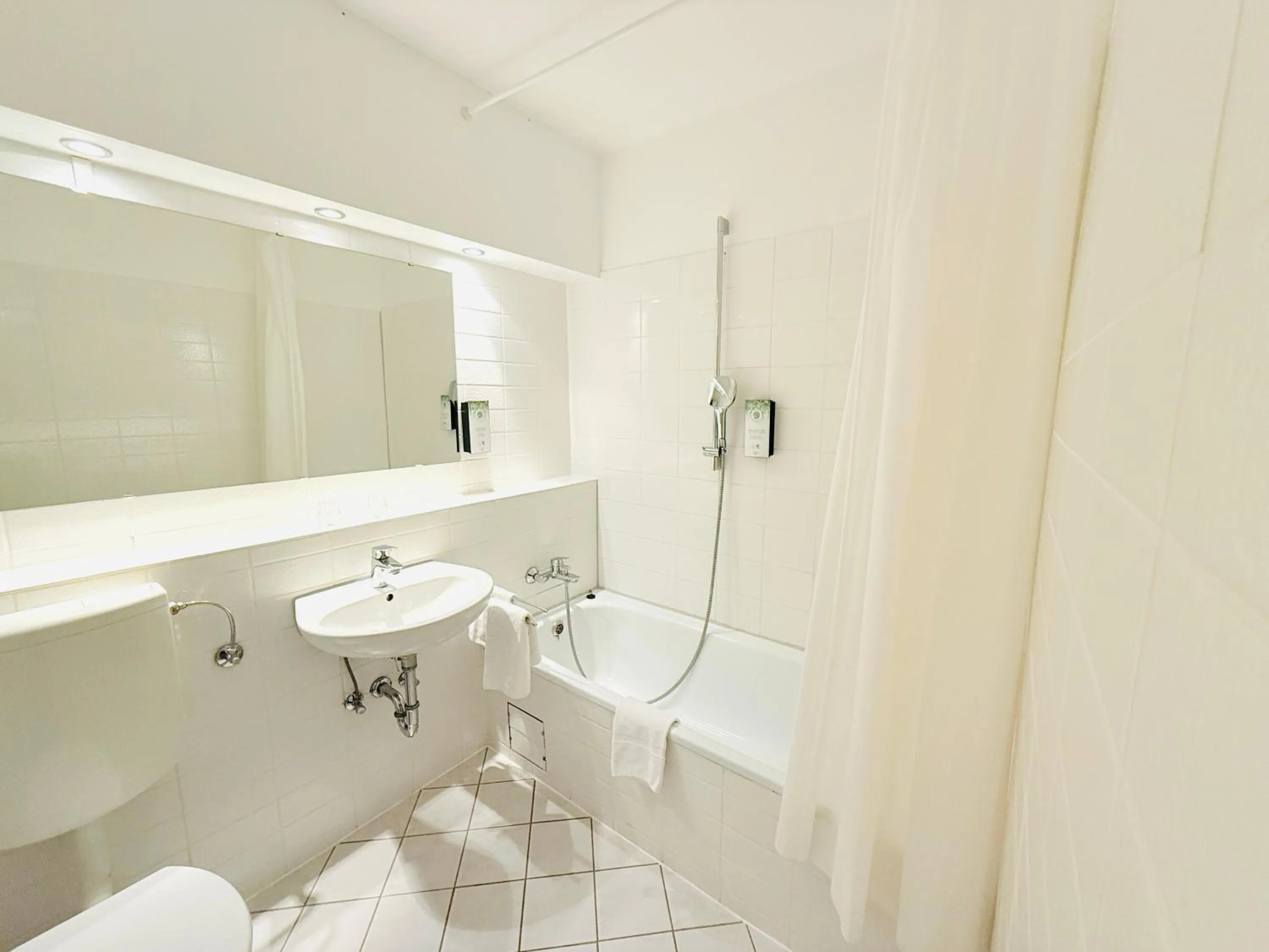 Bathroom in Hotel Plöner See by Tulip Inn