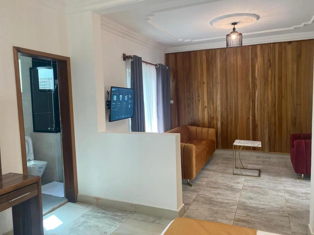 Communal lounge/ TV room in Hotel Residence La Corniche