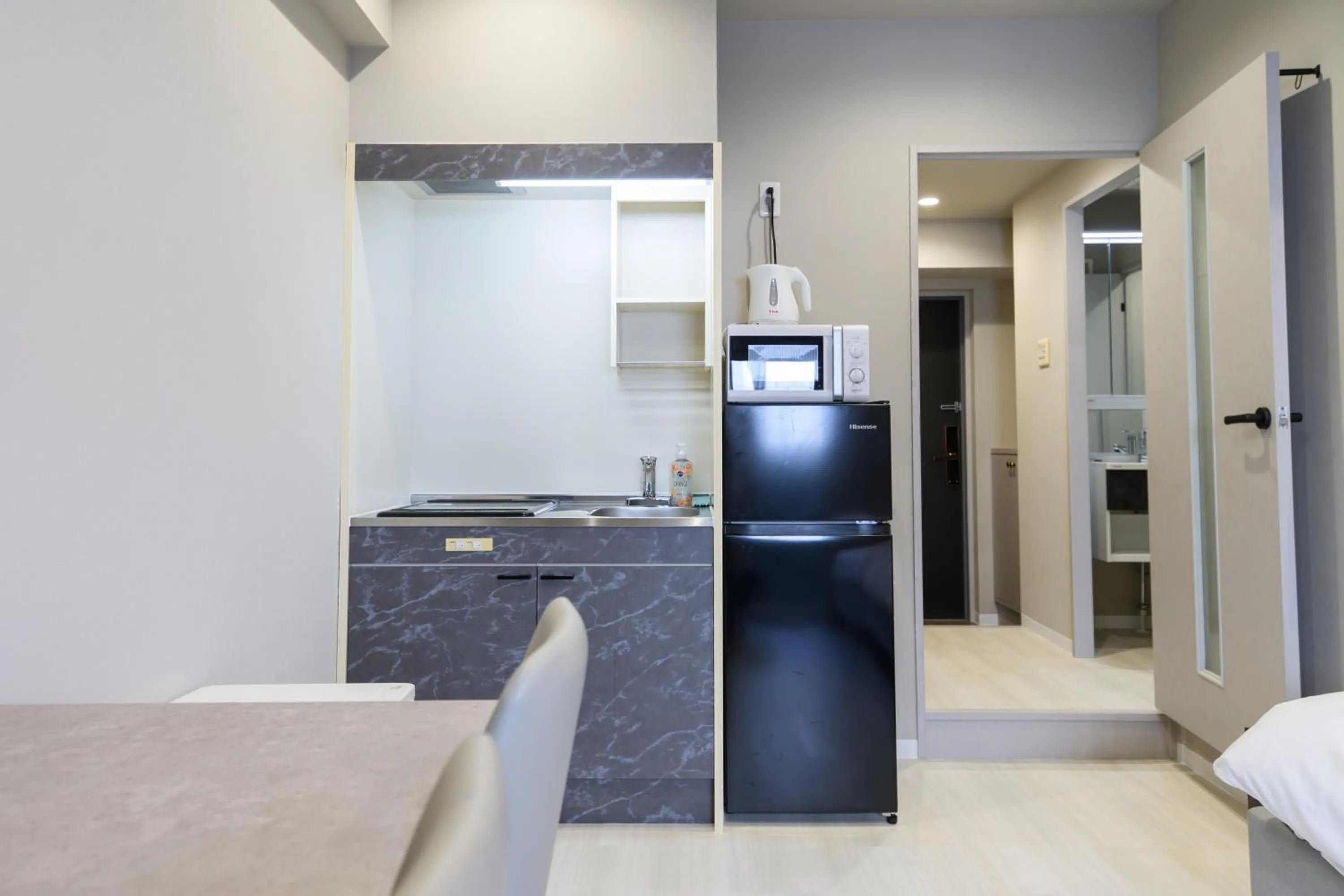 Kitchen or kitchenette in Ostay Kitahama Hotel Apartment