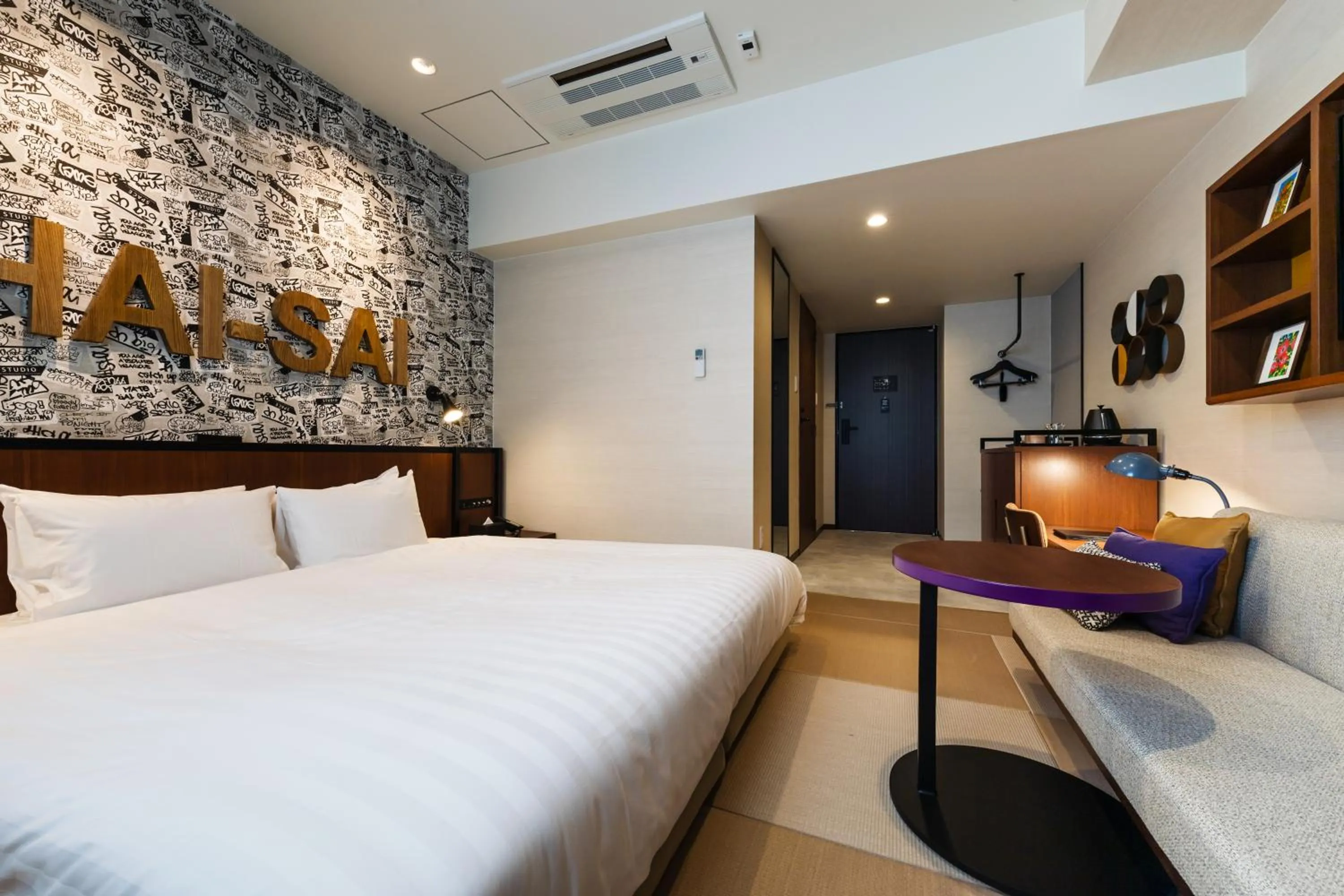 Bed in PROSTYLE RYOKAN Naha Kenchou Mae