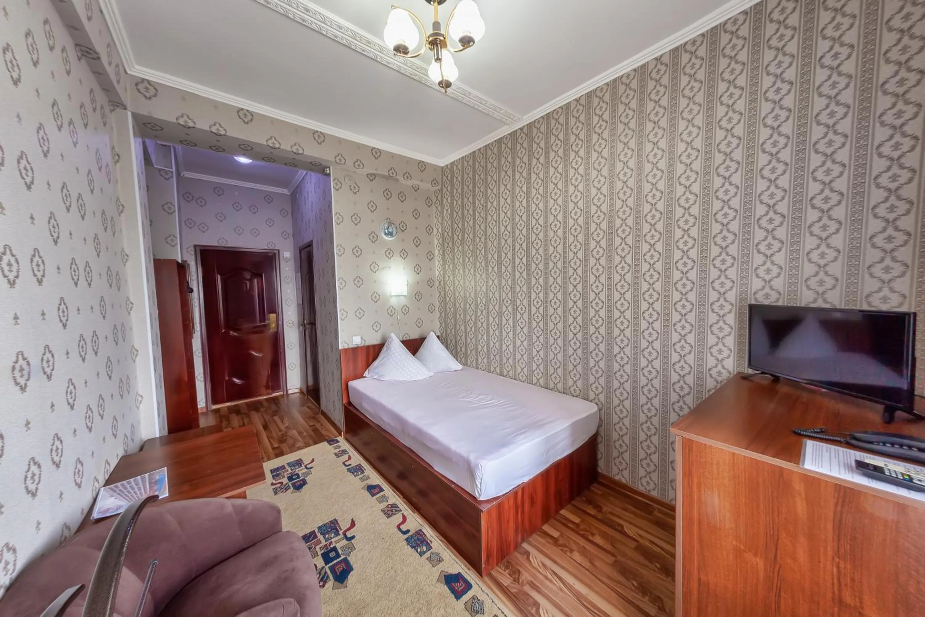 Bed in Hotel Osh-Nuru