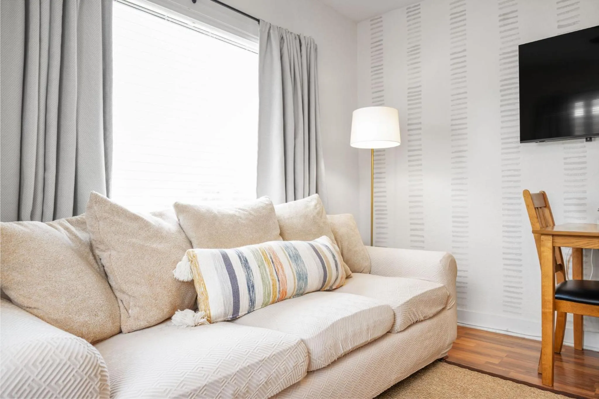 Living room in The Flats on Florida St - Super Comfy 2-Bedroom Apartments