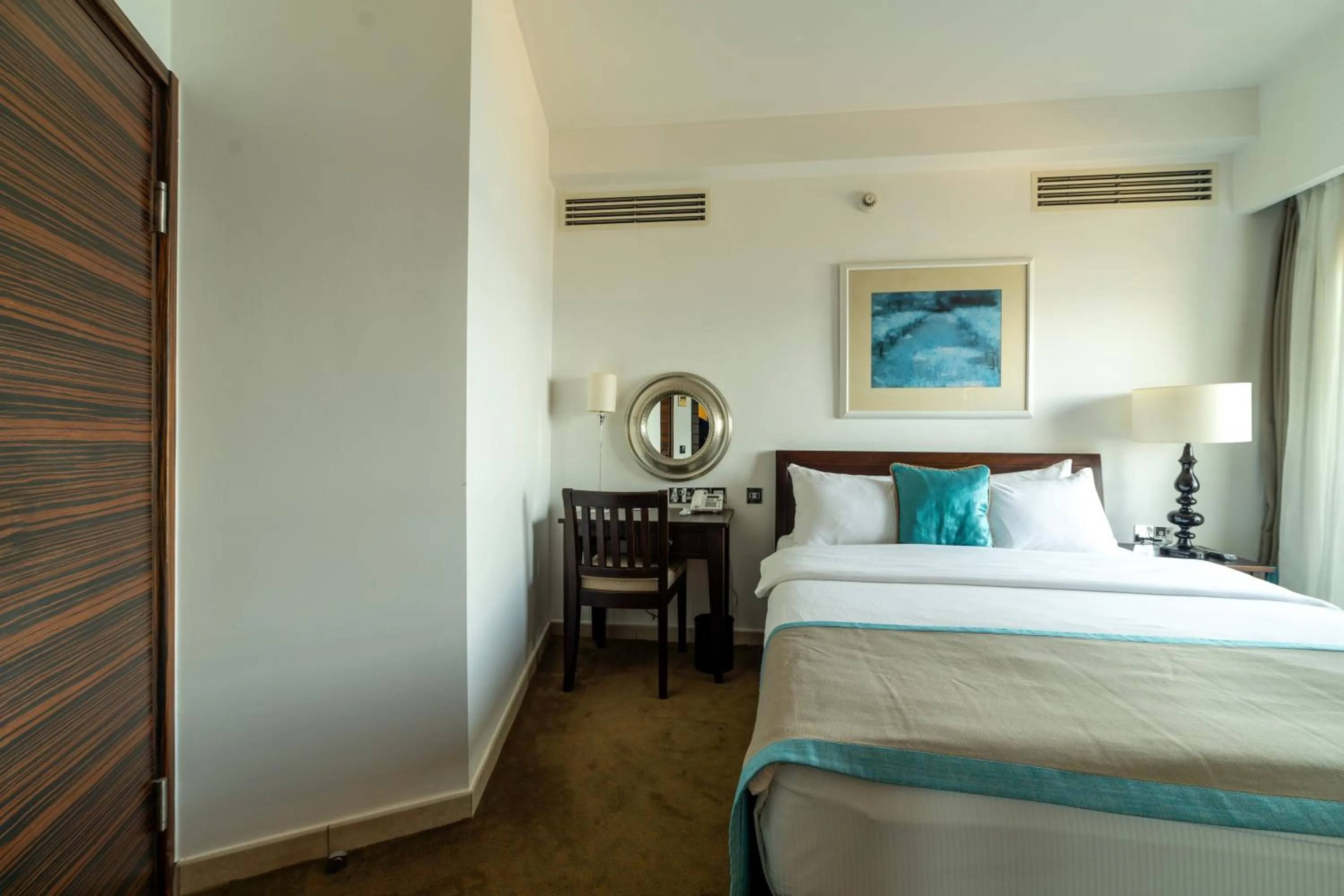 Bed in Arkin Palm Beach Hotel