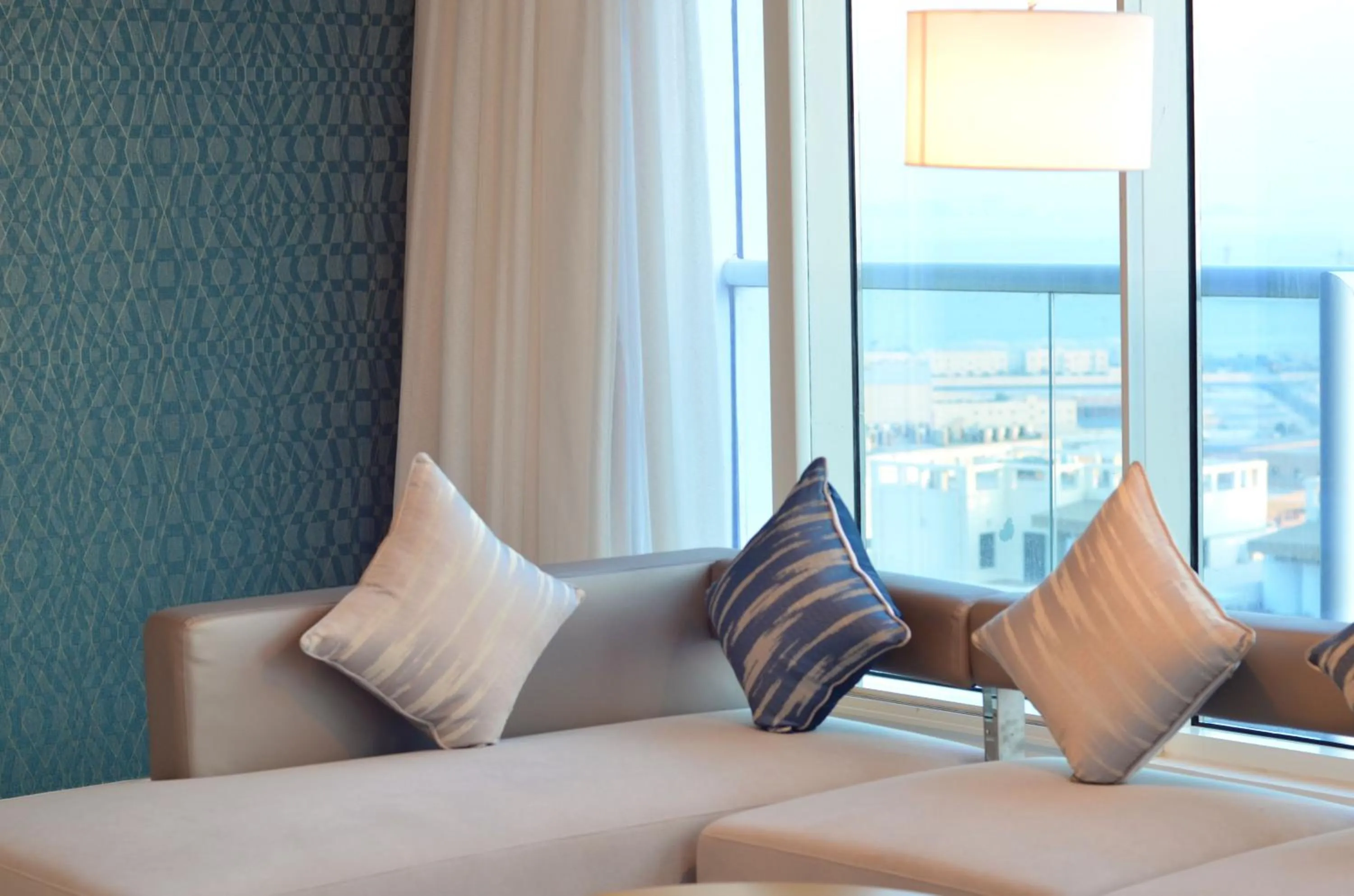 Living room, Bed in The Lodge Suites