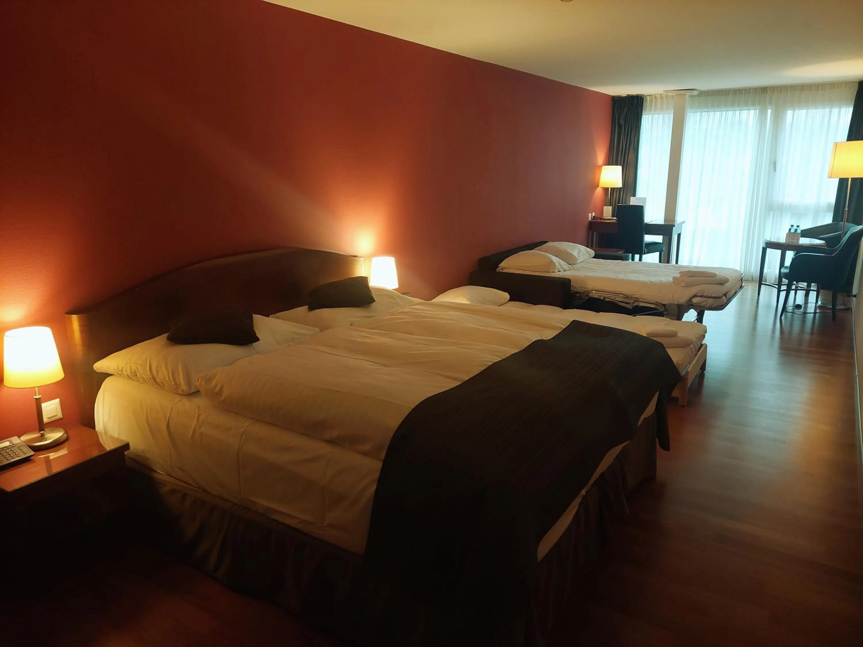 Photo of the whole room, Bed in Hôtel Rallye & Entrées aux Bains de la Gruyère