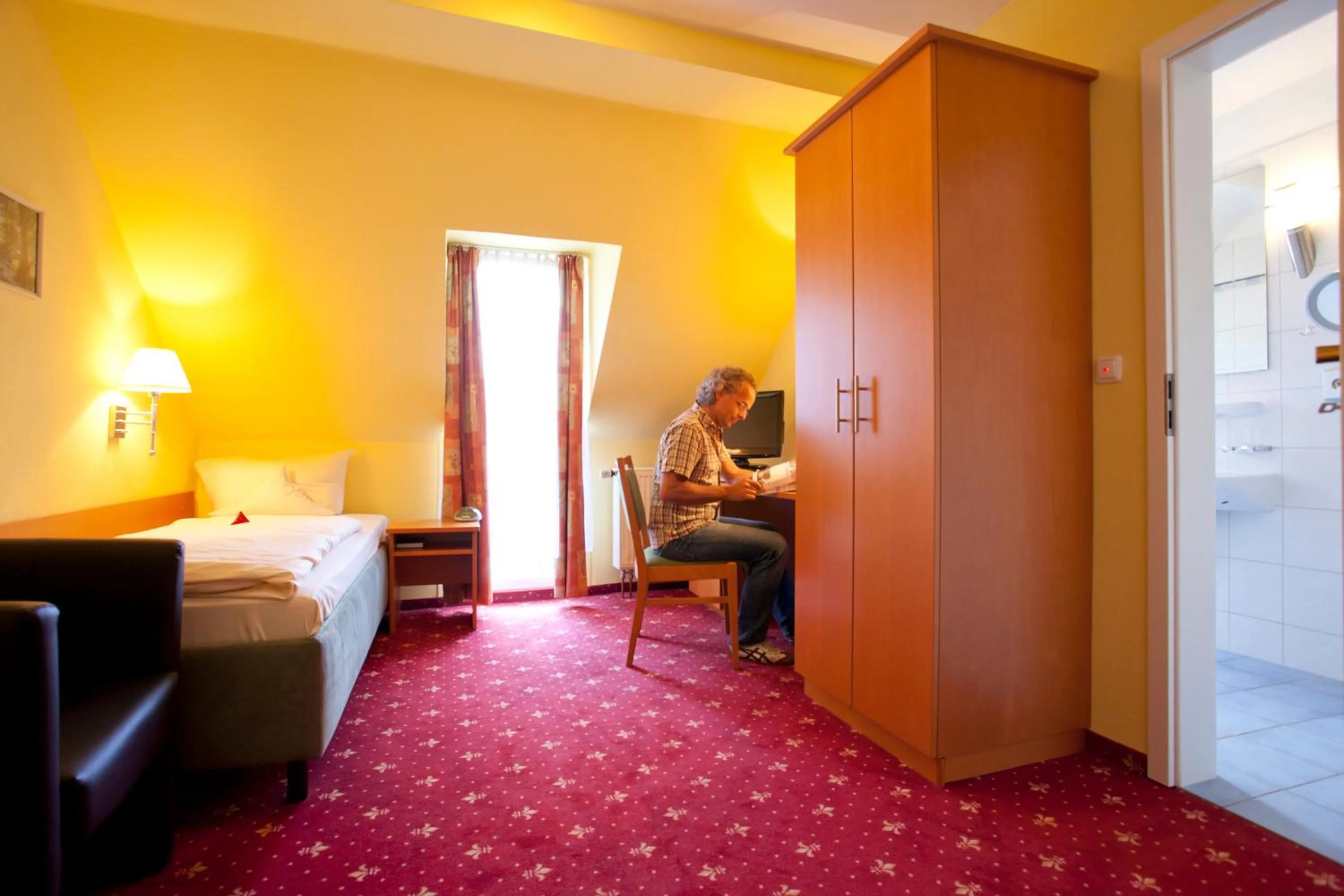 Photo of the whole room, Bed in Akzent Hotel Goldner Stern