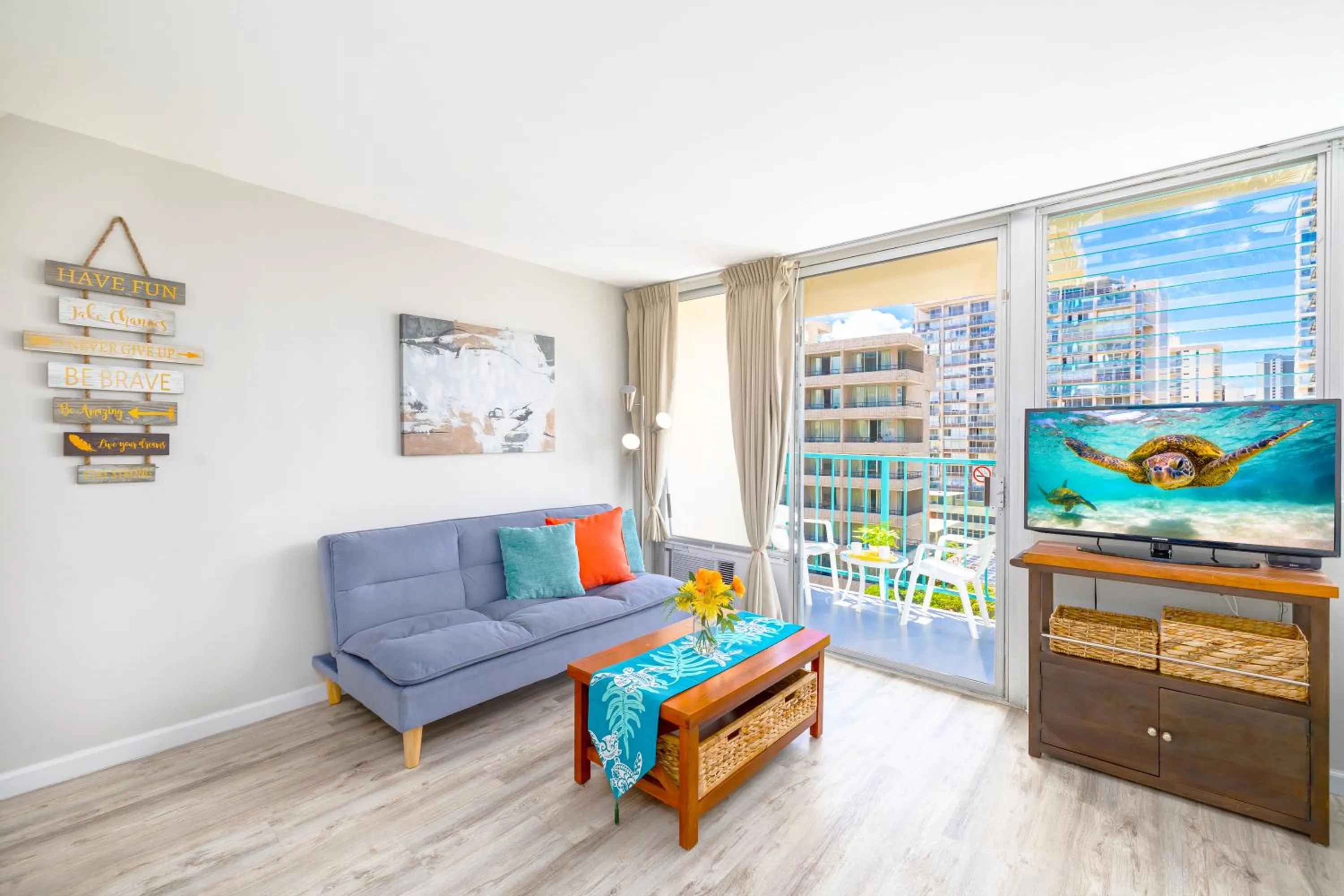 Living room in Cozy Waikiki Studio at Aqua Aloha Surf