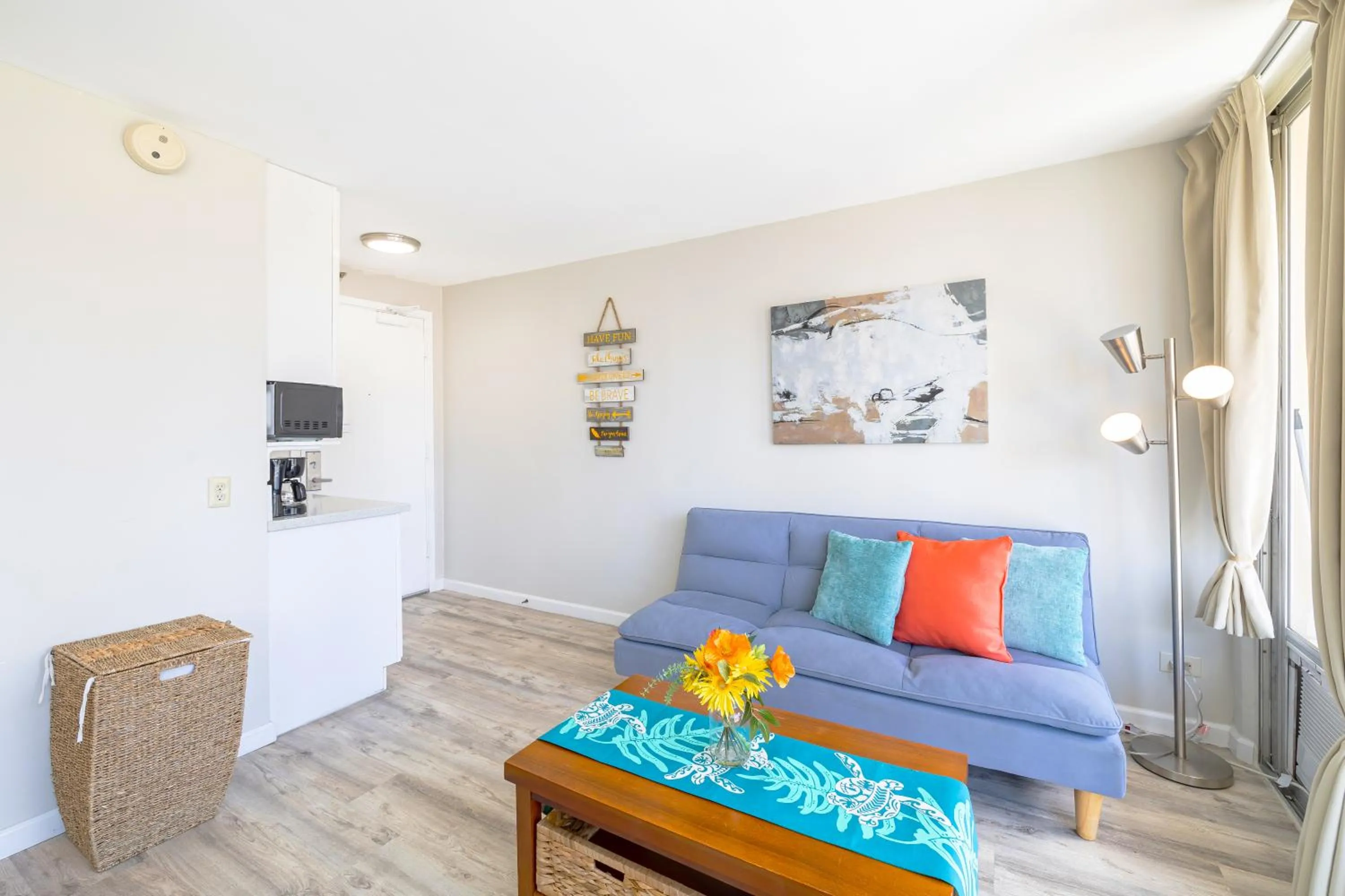 Living room in Cozy Waikiki Studio at Aqua Aloha Surf