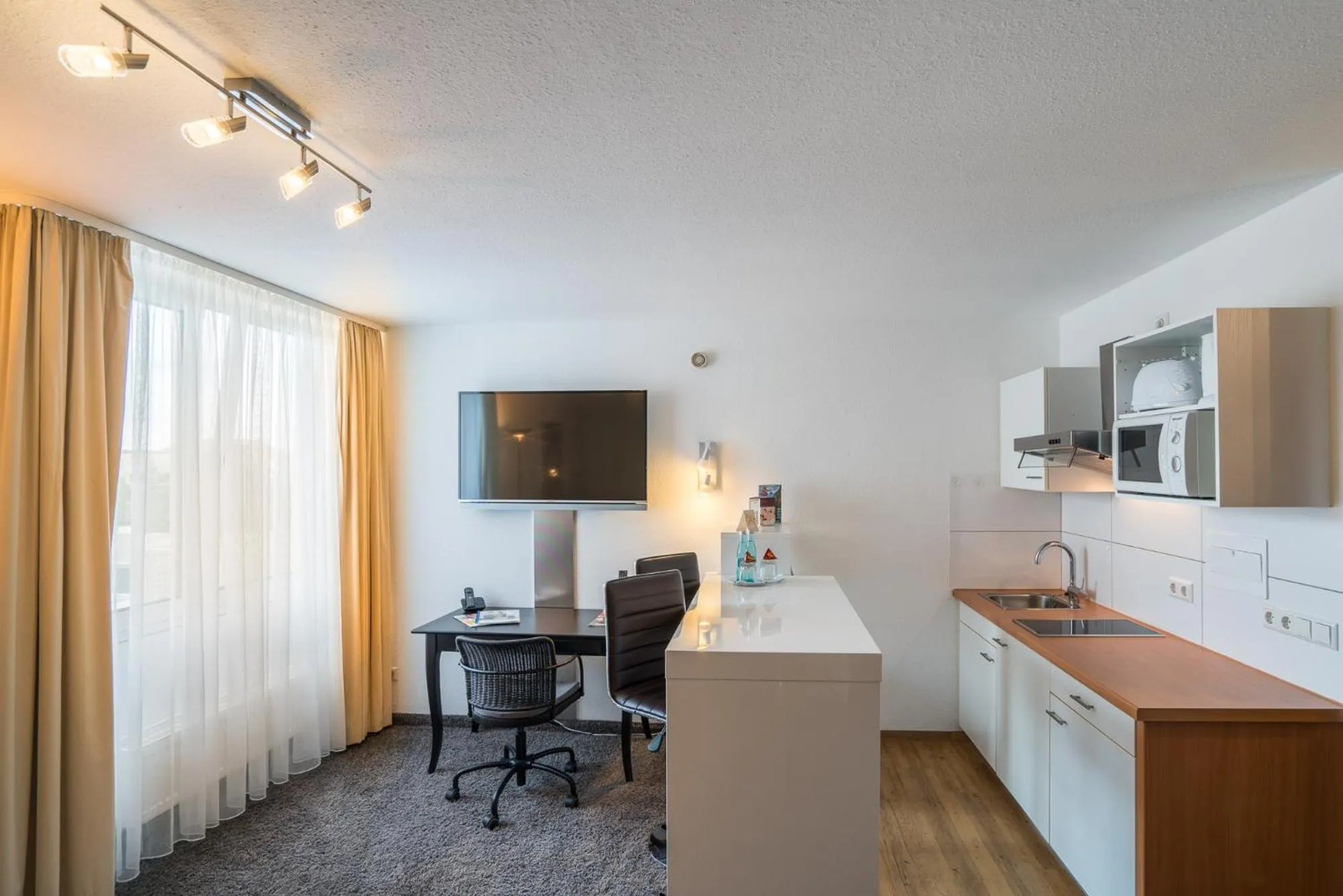 Kitchen or kitchenette in Apartmenthotel Residenz Steinenbronn