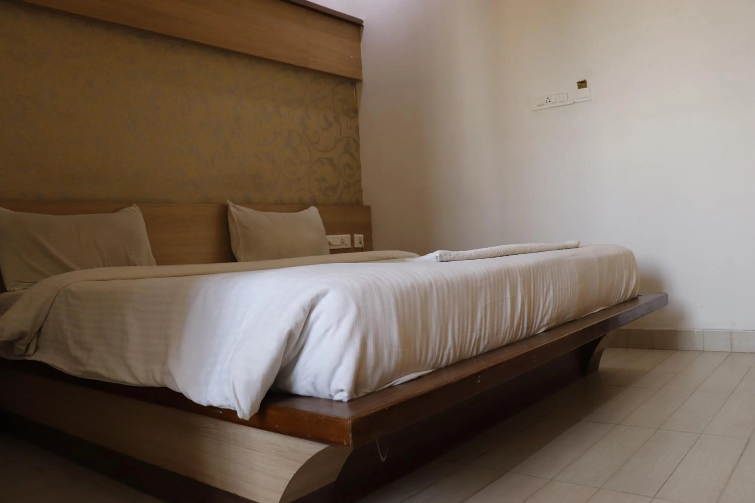 Bed in HOTEL SRI VAARI RESIDENCY