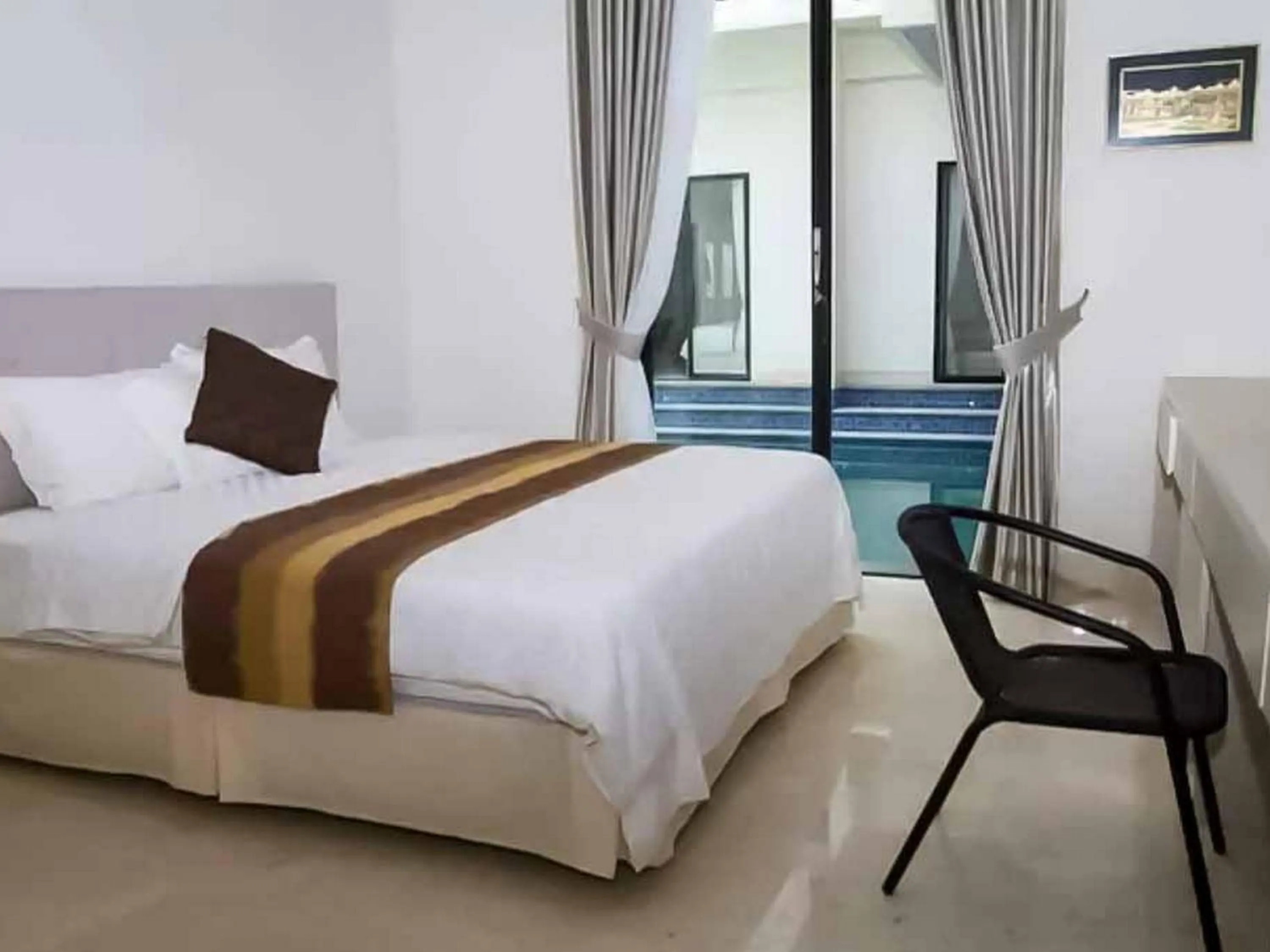 Bed in Bangka Suite Mitra RedDoorz