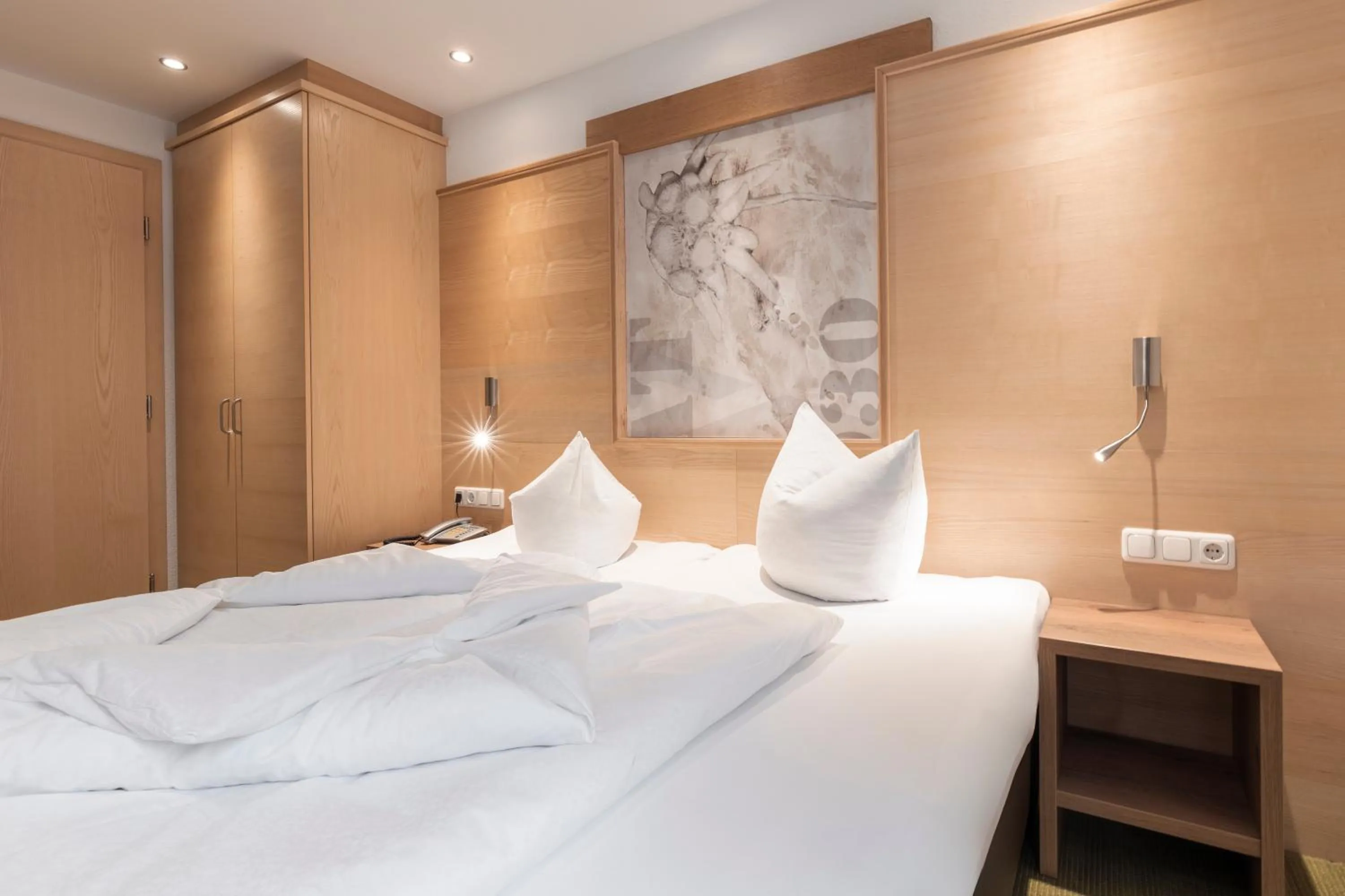 Bed in SCHMID Rooms & Apartments