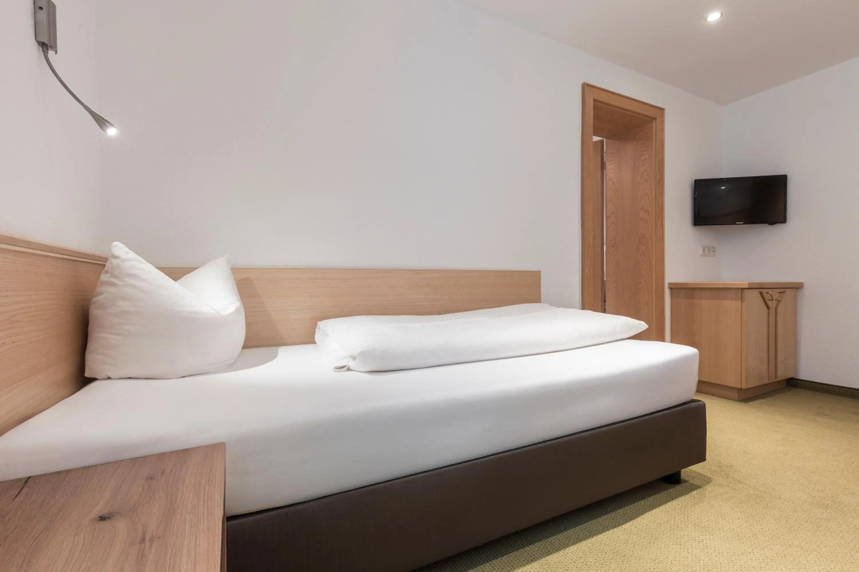 Bed in SCHMID Rooms & Apartments