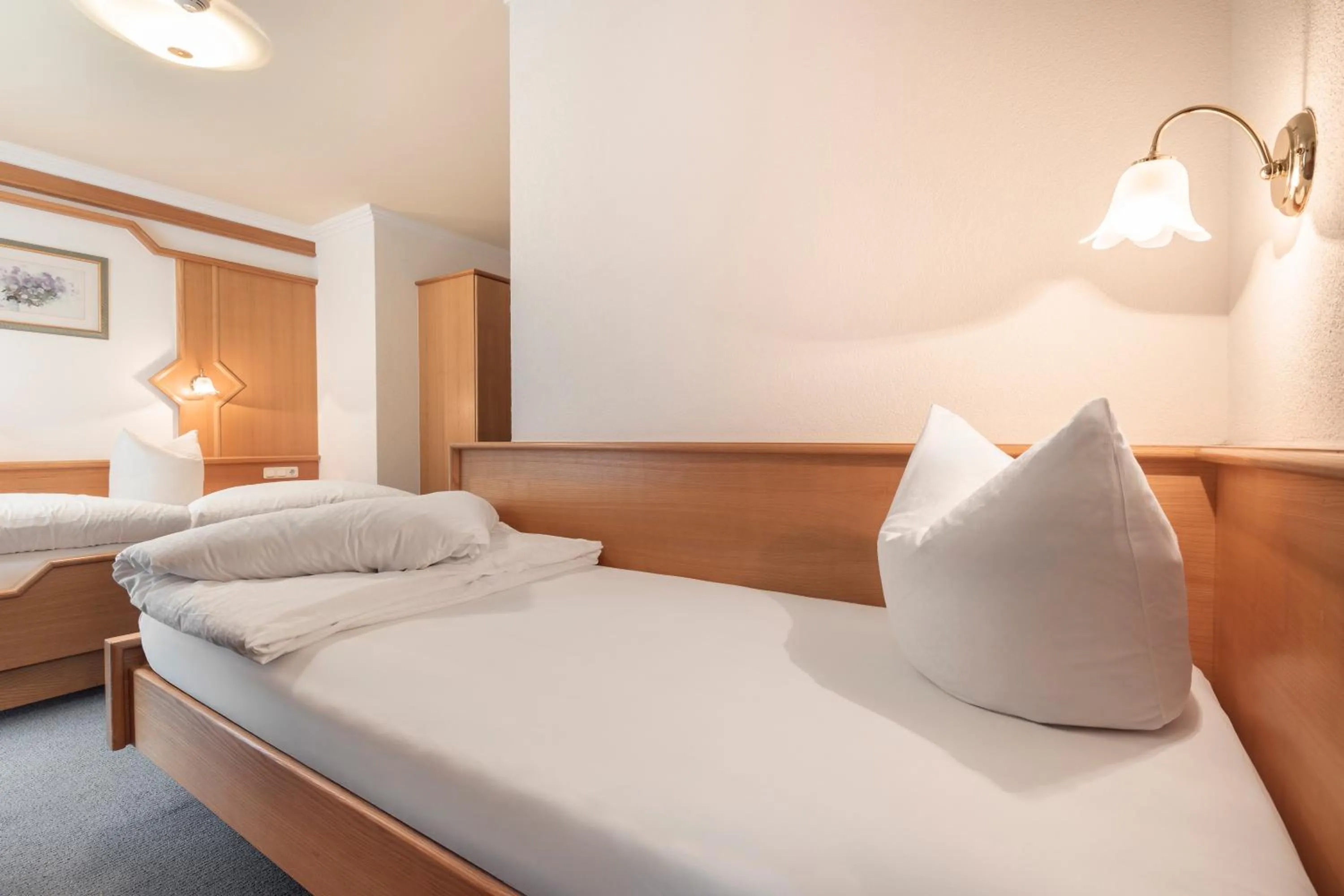 Bed in SCHMID Rooms & Apartments