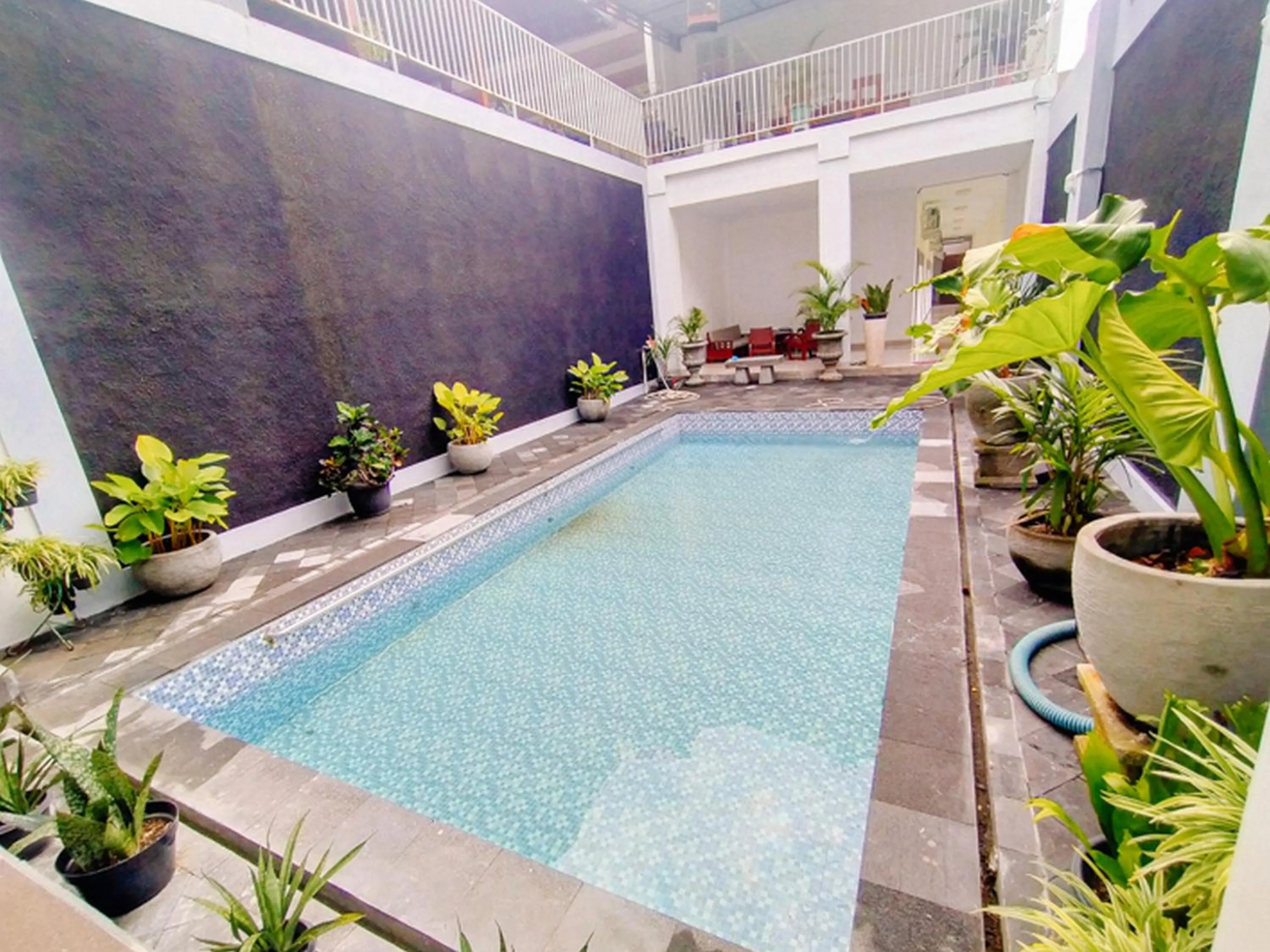 Swimming pool in RedDoorz At Artomoro Guest House