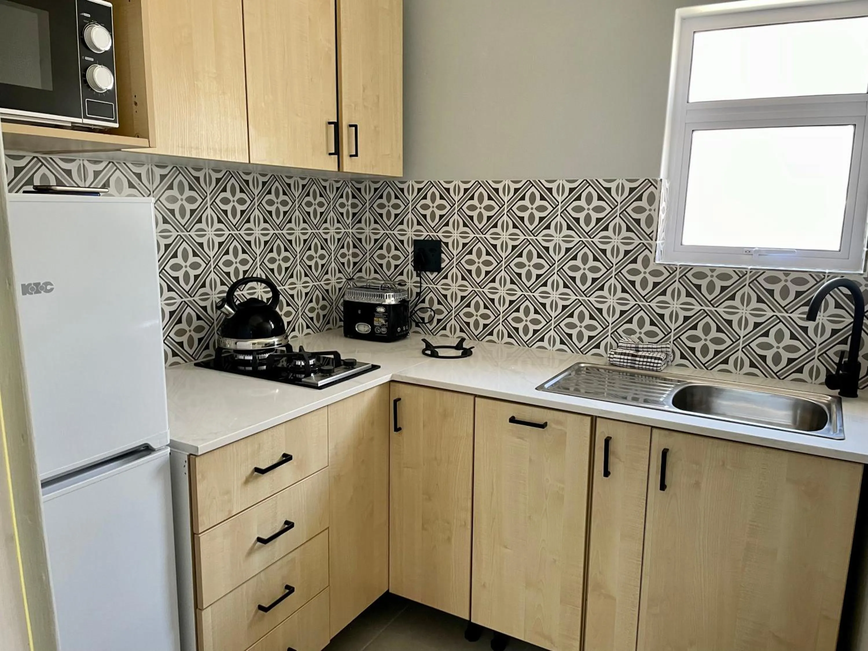 Kitchen or kitchenette in Sandra's Guest House