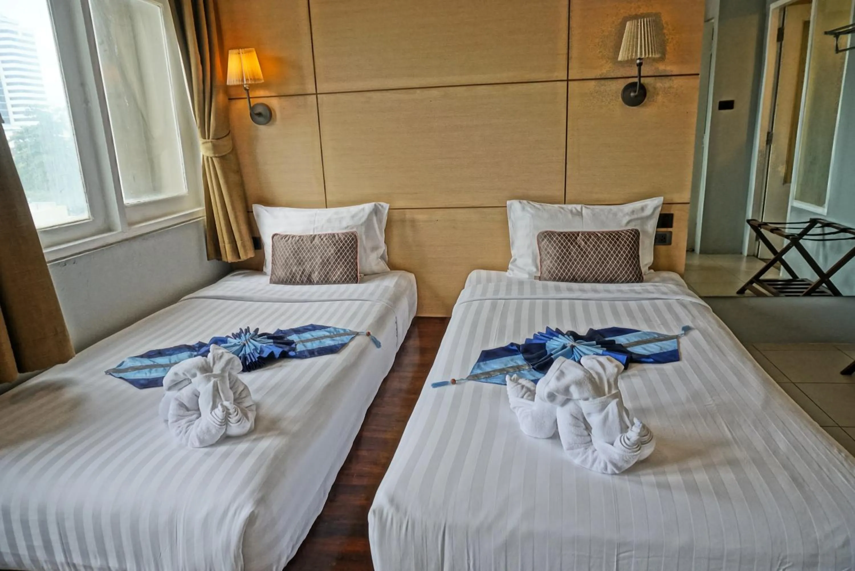 Bed in Montree Phuket Hotel