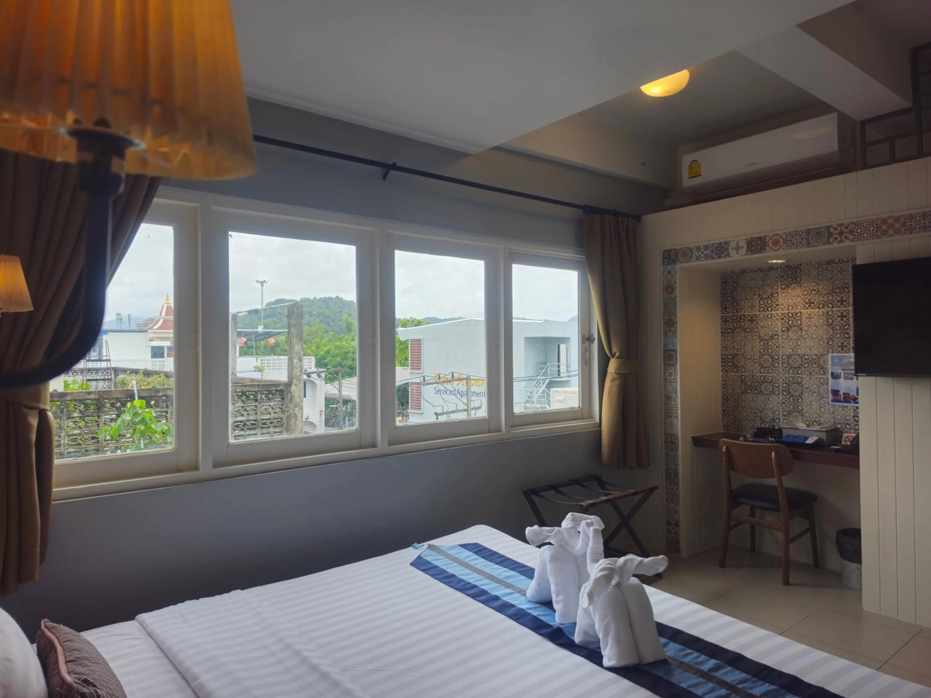 Bed in Montree Phuket Hotel