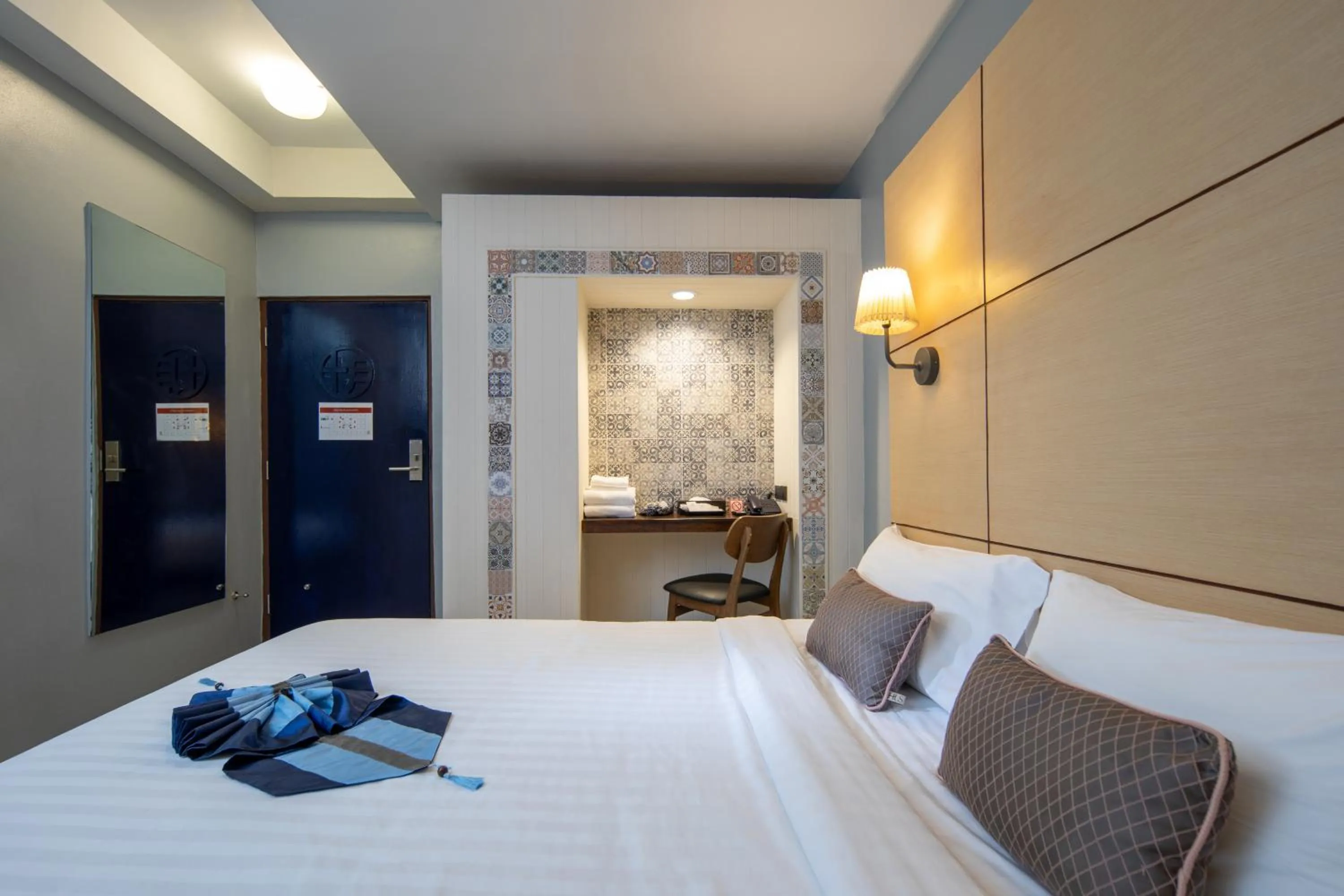 Bed in Montree Phuket Hotel