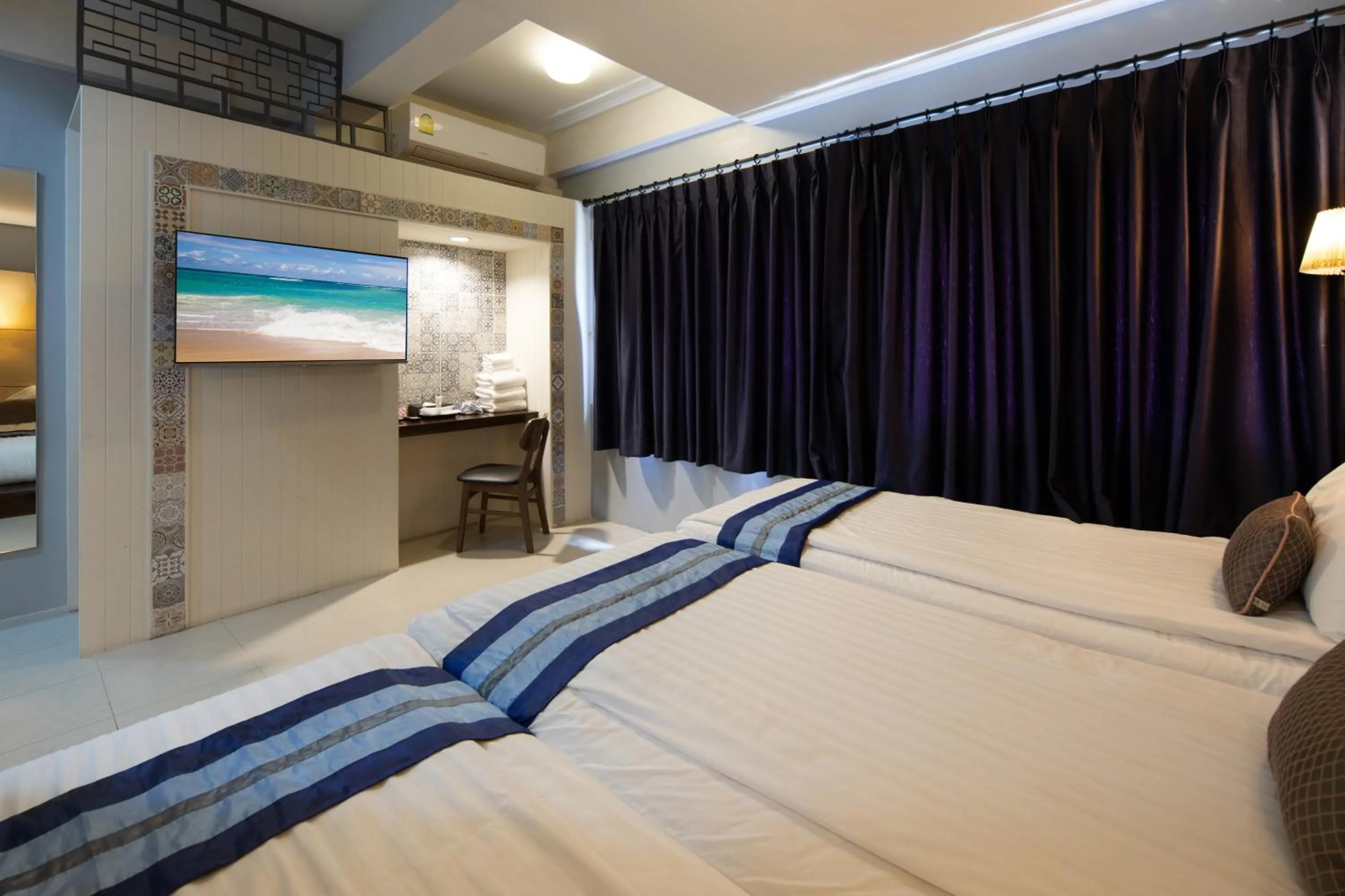 Bed in Montree Phuket Hotel