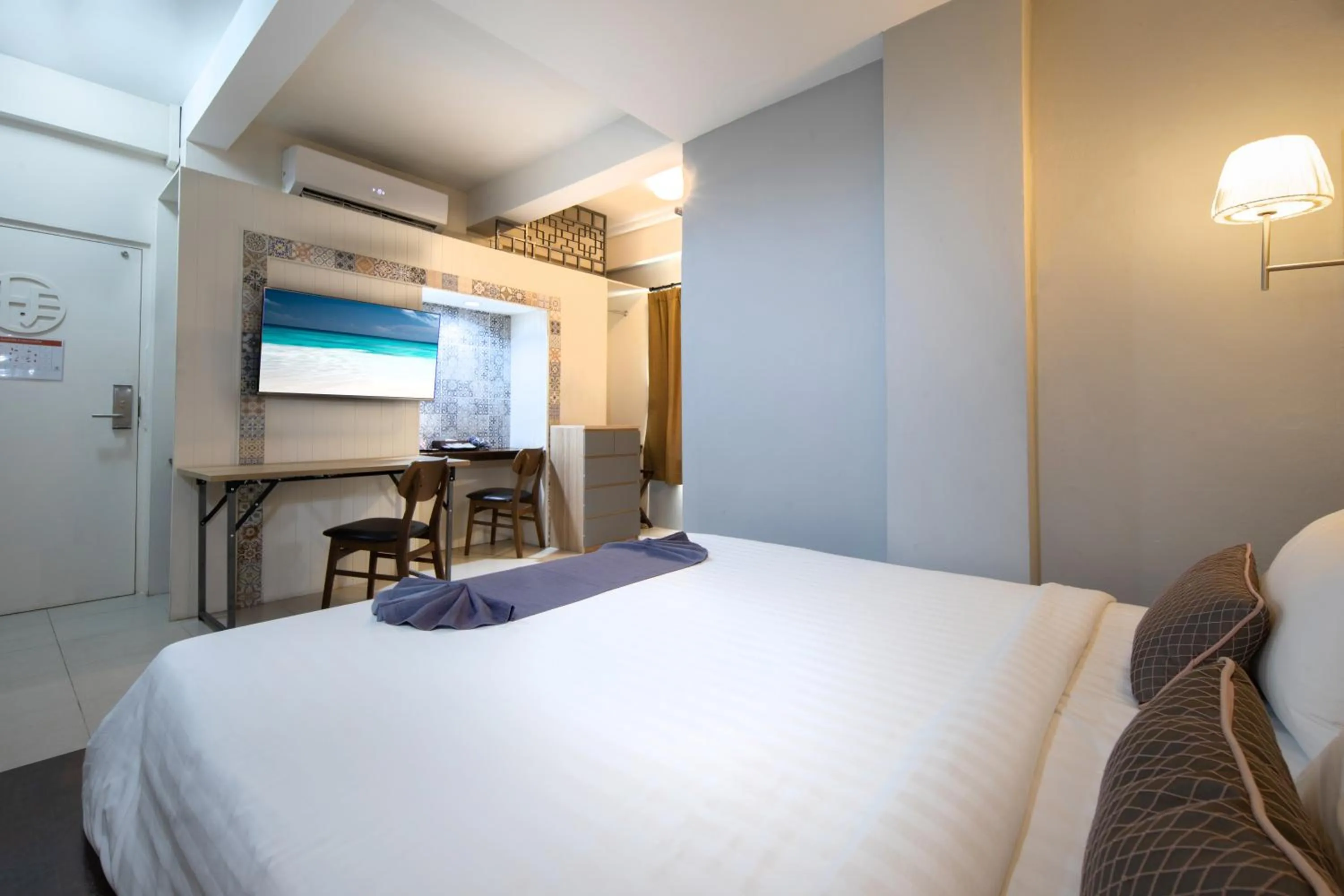 Bed in Montree Phuket Hotel