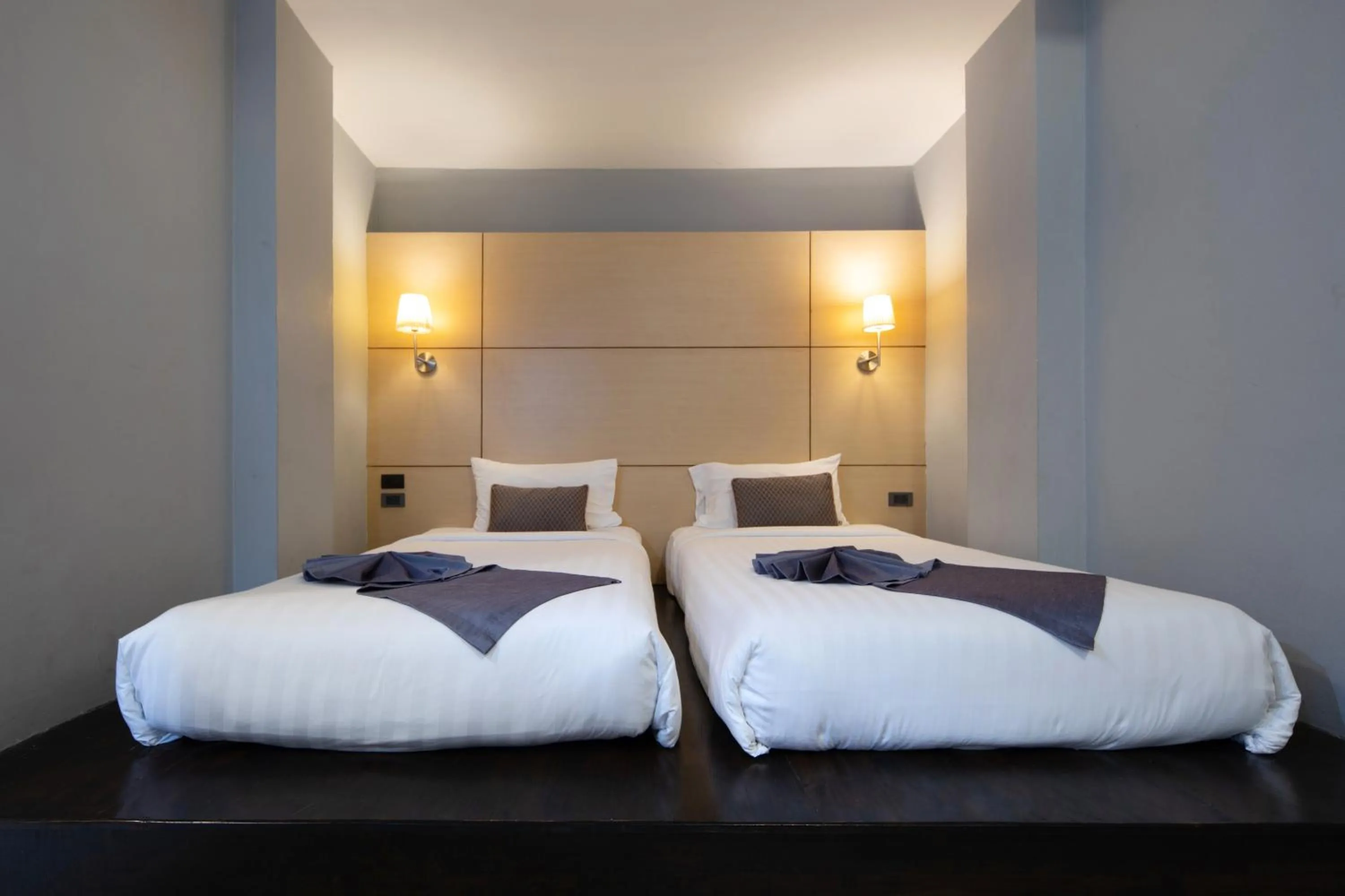 Bed in Montree Phuket Hotel