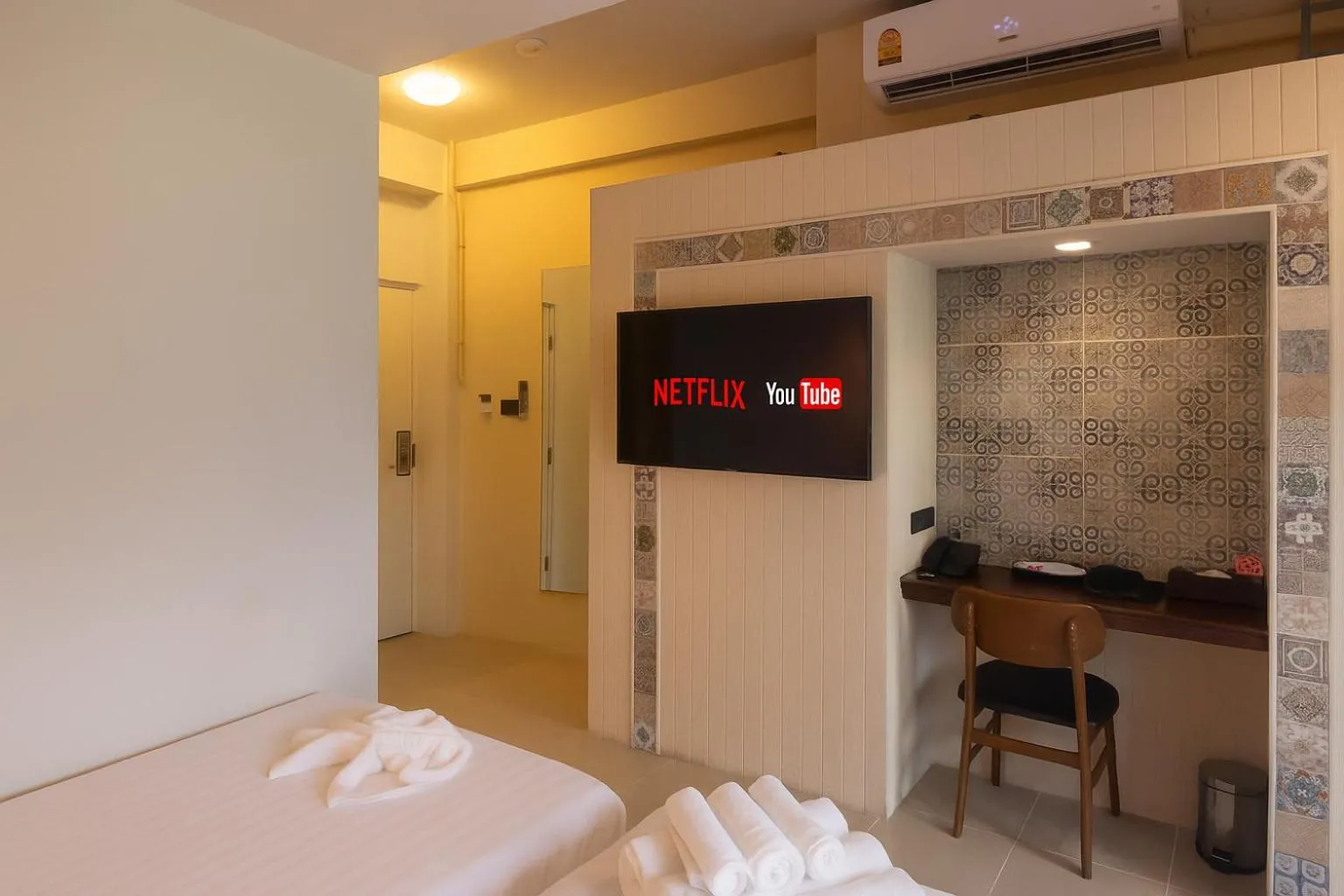 Bed in Montree Phuket Hotel