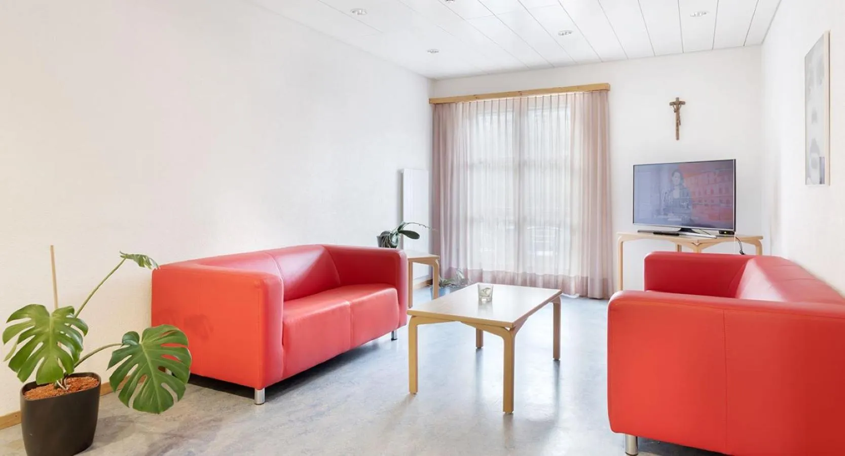 Communal lounge/ TV room in Hotel & Bildungshaus St. Jodern