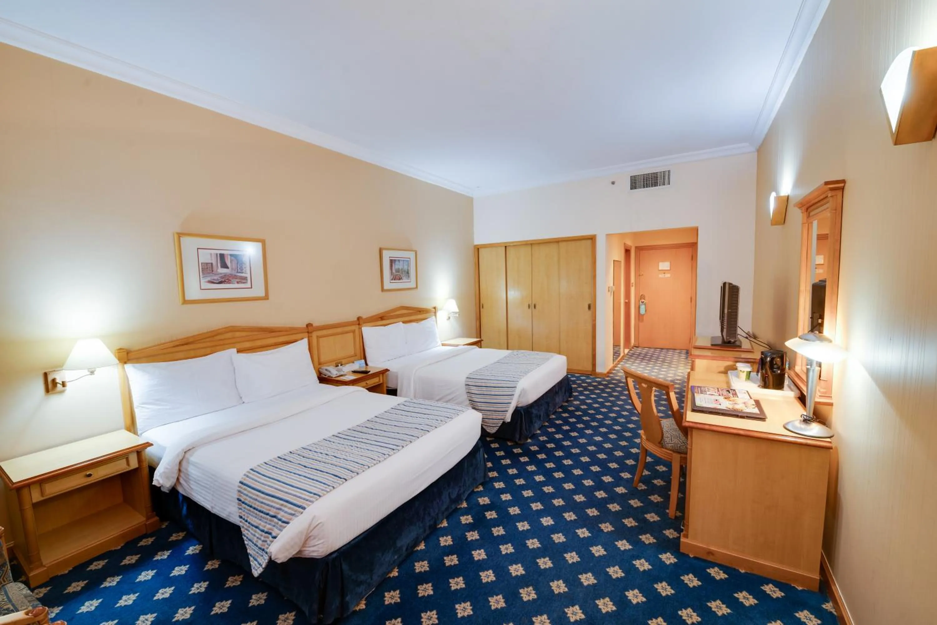 Photo of the whole room, Bed in Grand Continental Hotel