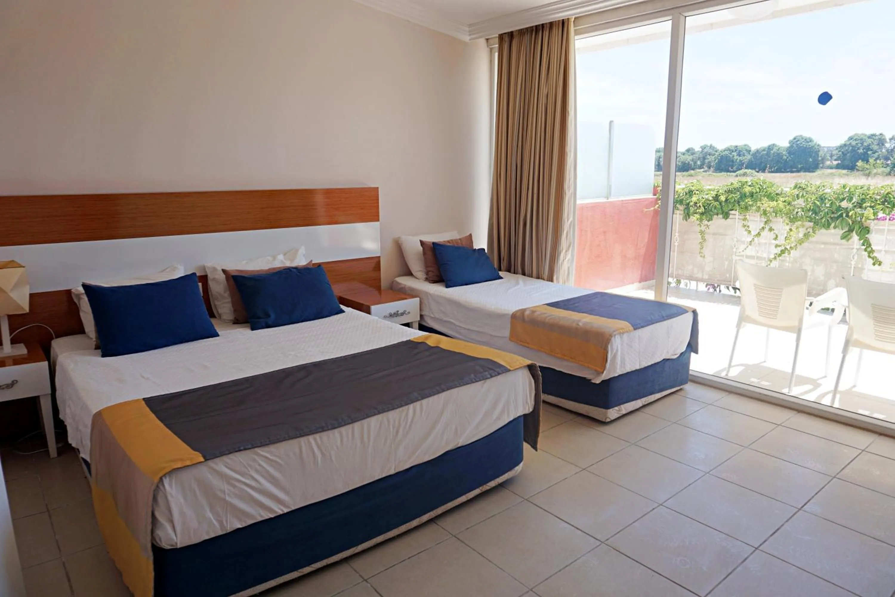 Bed in Side Legend Hotel