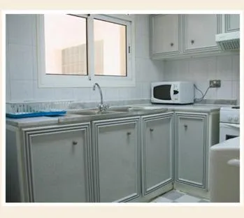 Kitchen or kitchenette in Royal Plaza Hotel Apartments