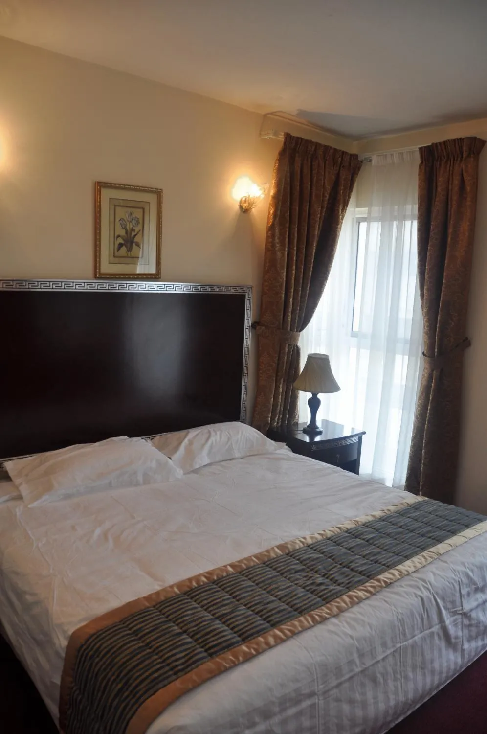 Bed in Royal Plaza Hotel Apartments