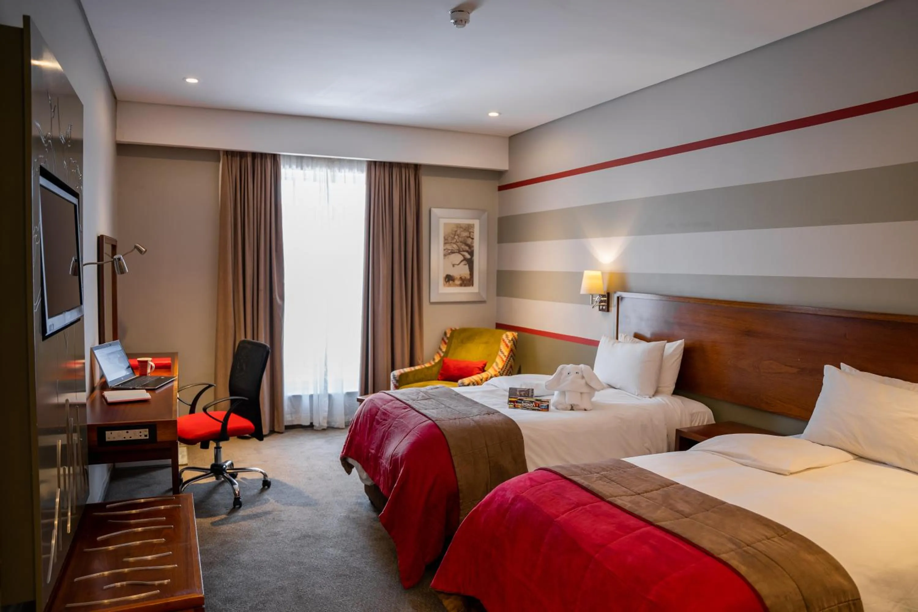 Photo of the whole room, Bed in Indaba Lodge Gaborone