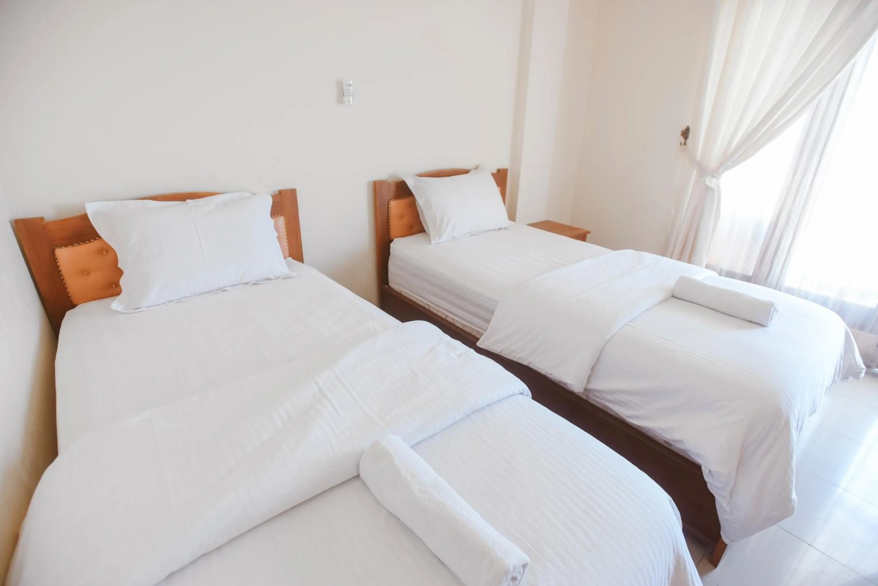 Bed in CHRYSANT HOTEL & RESORT