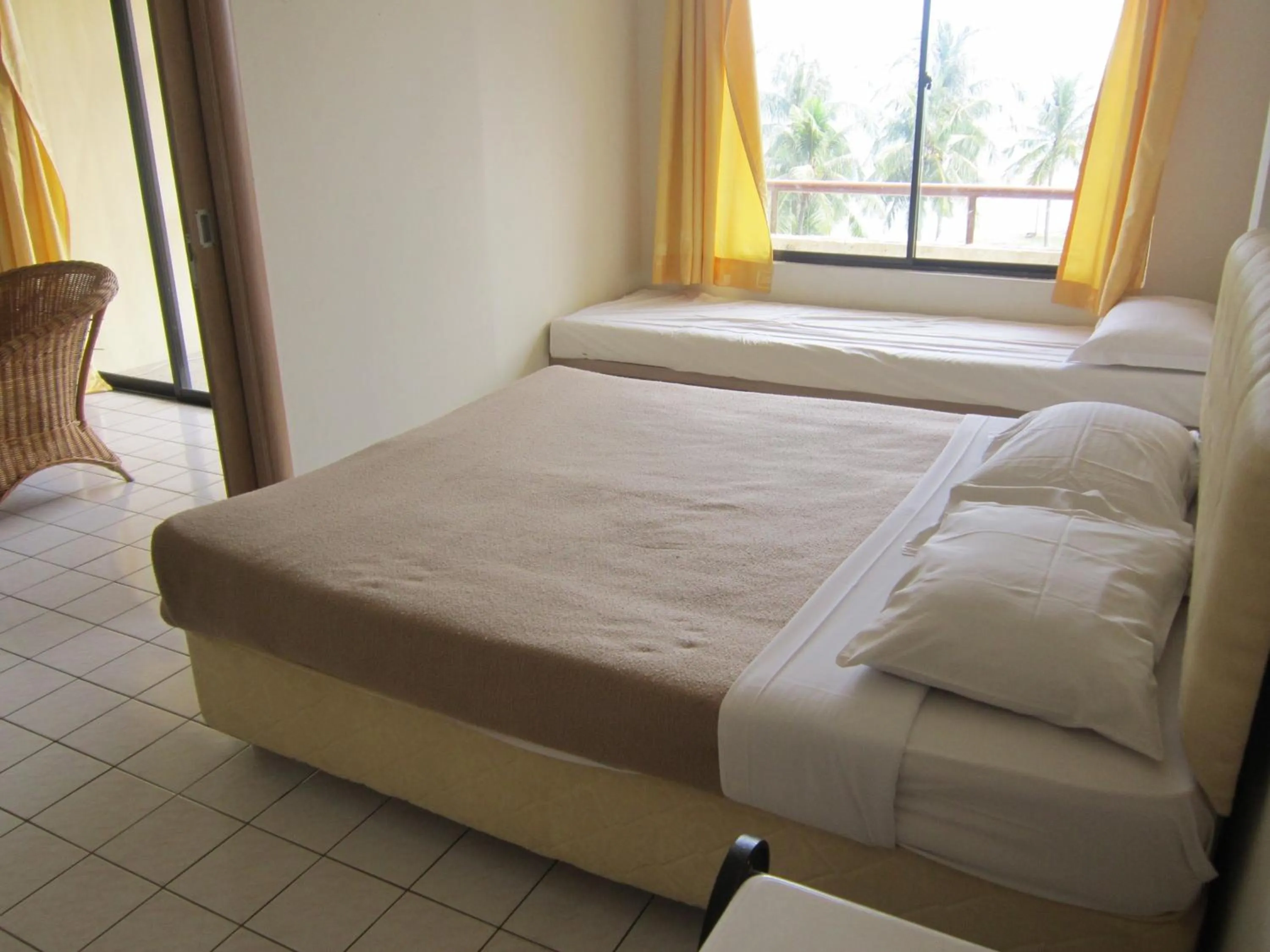 Bed in Paradise Lagoon Apartment