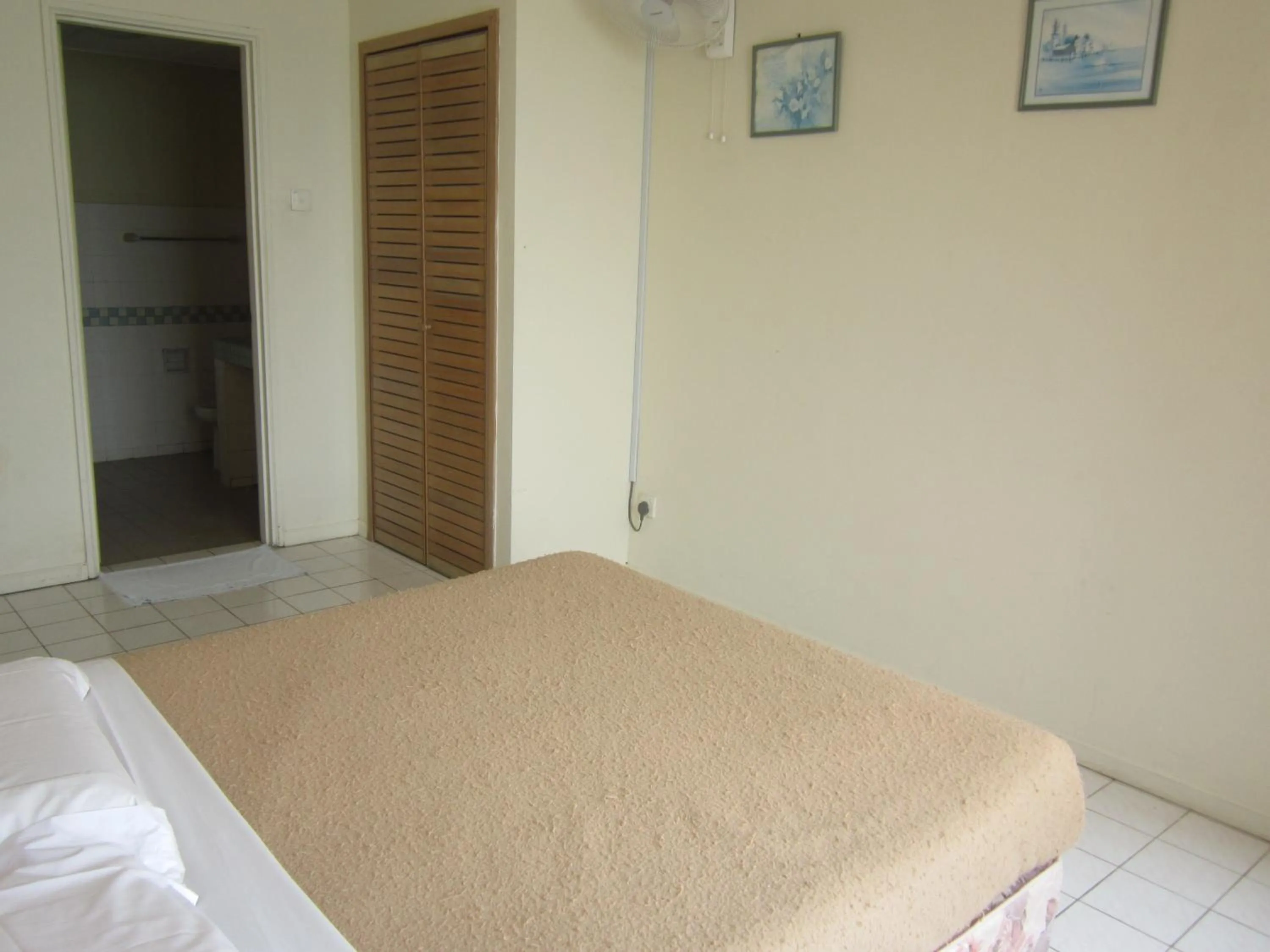 Bed in Paradise Lagoon Apartment