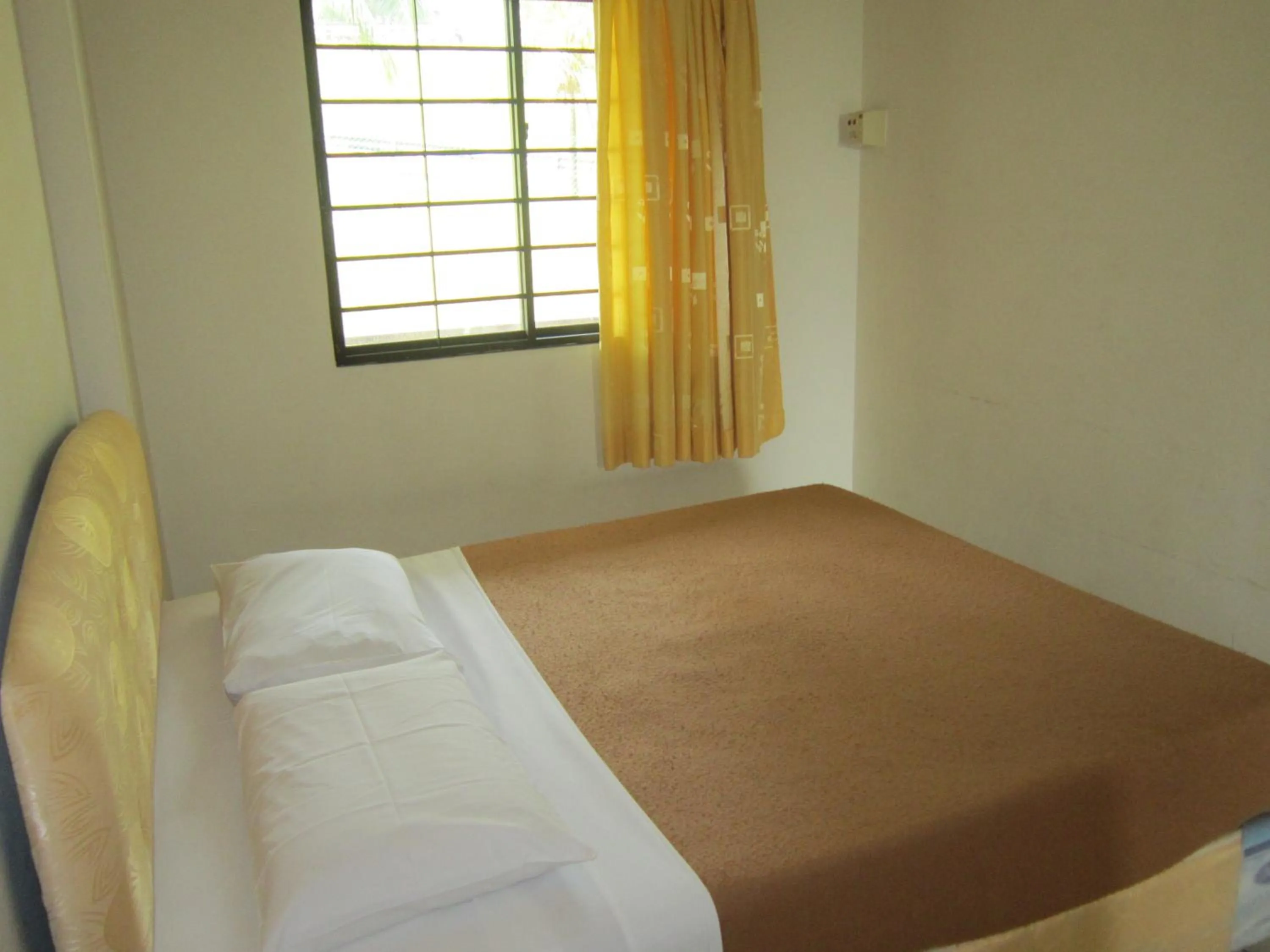 Bed in Paradise Lagoon Apartment