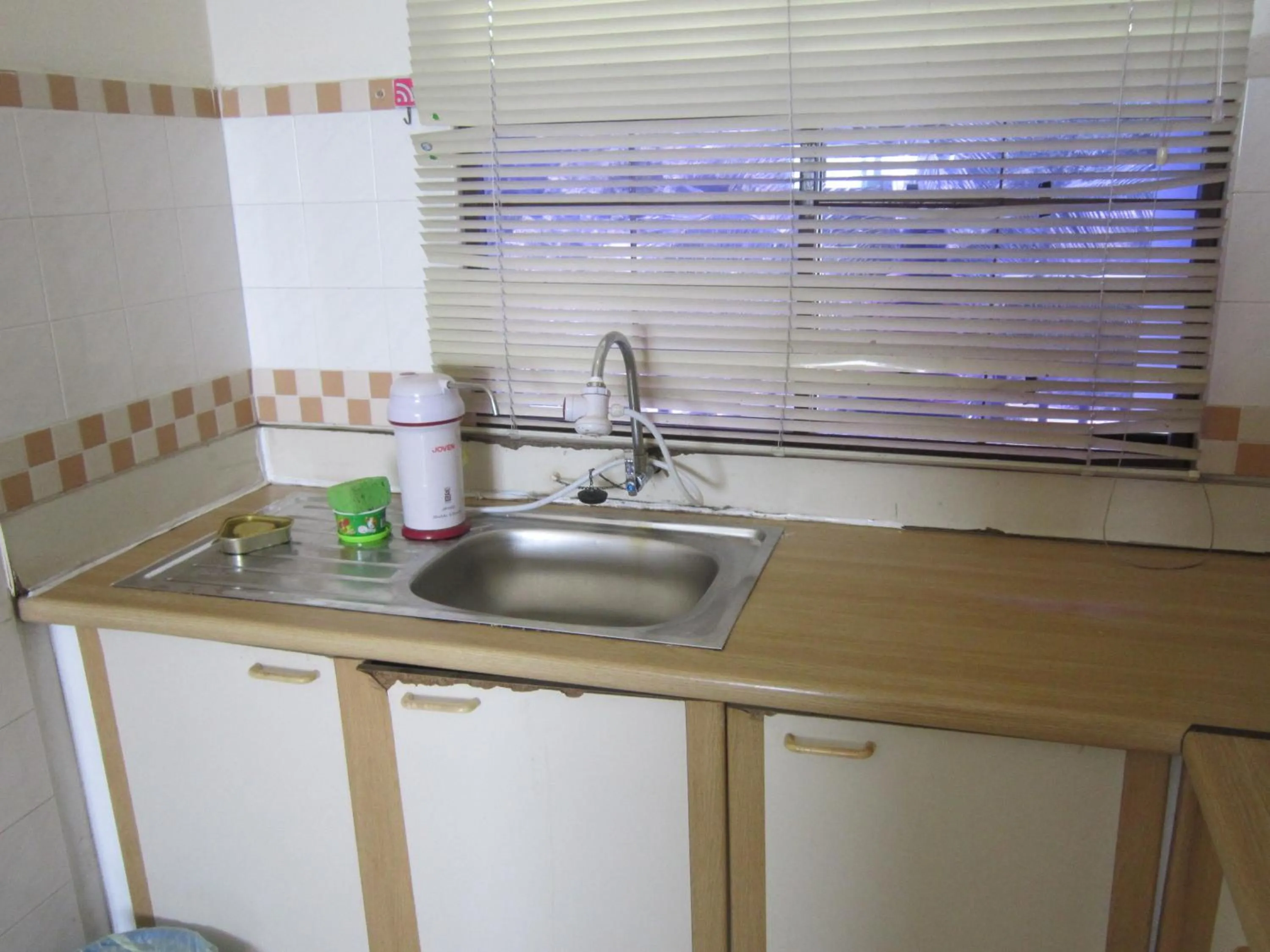 Kitchen or kitchenette in Paradise Lagoon Apartment
