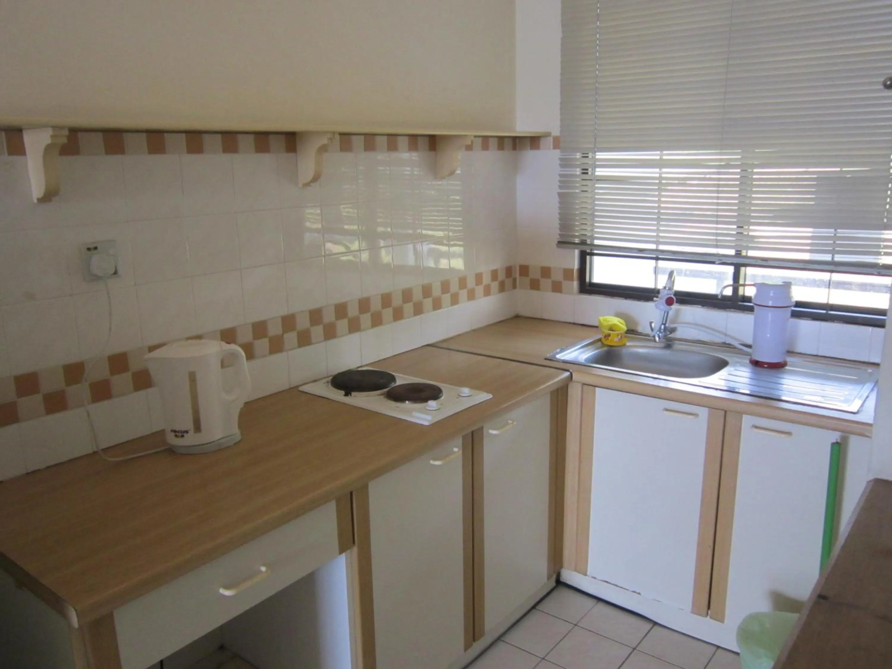 Kitchen or kitchenette in Paradise Lagoon Apartment