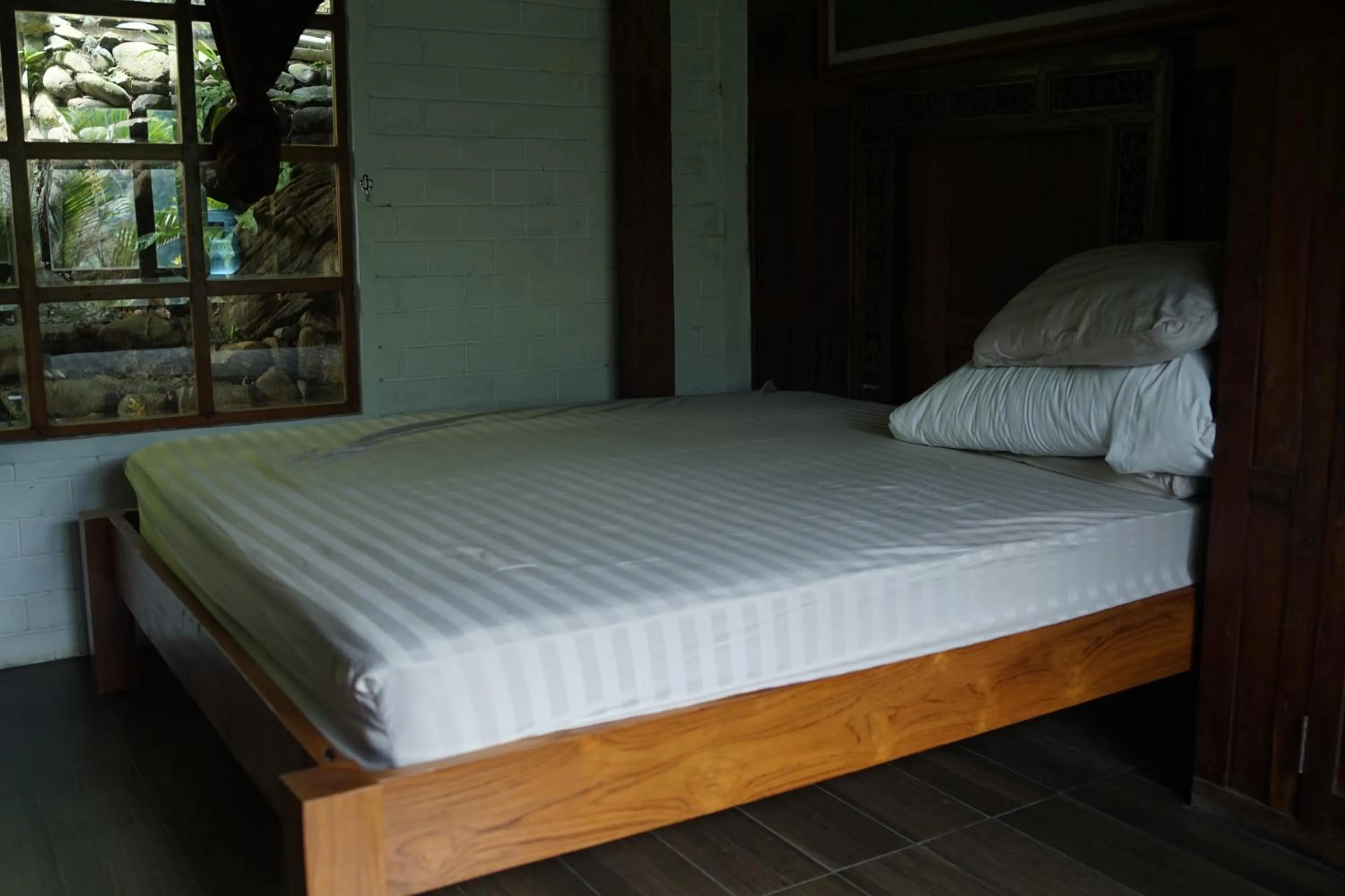 Bed in Tirta Arsanta Hot Springs & Villa