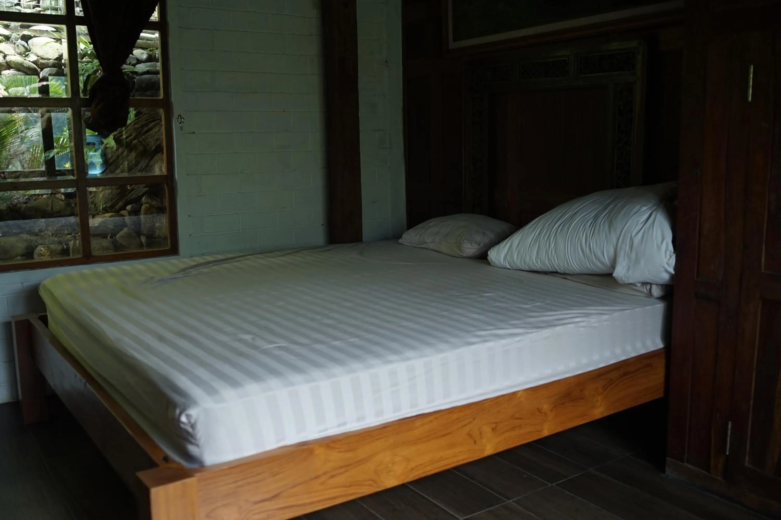 Bed in Tirta Arsanta Hot Springs & Villa