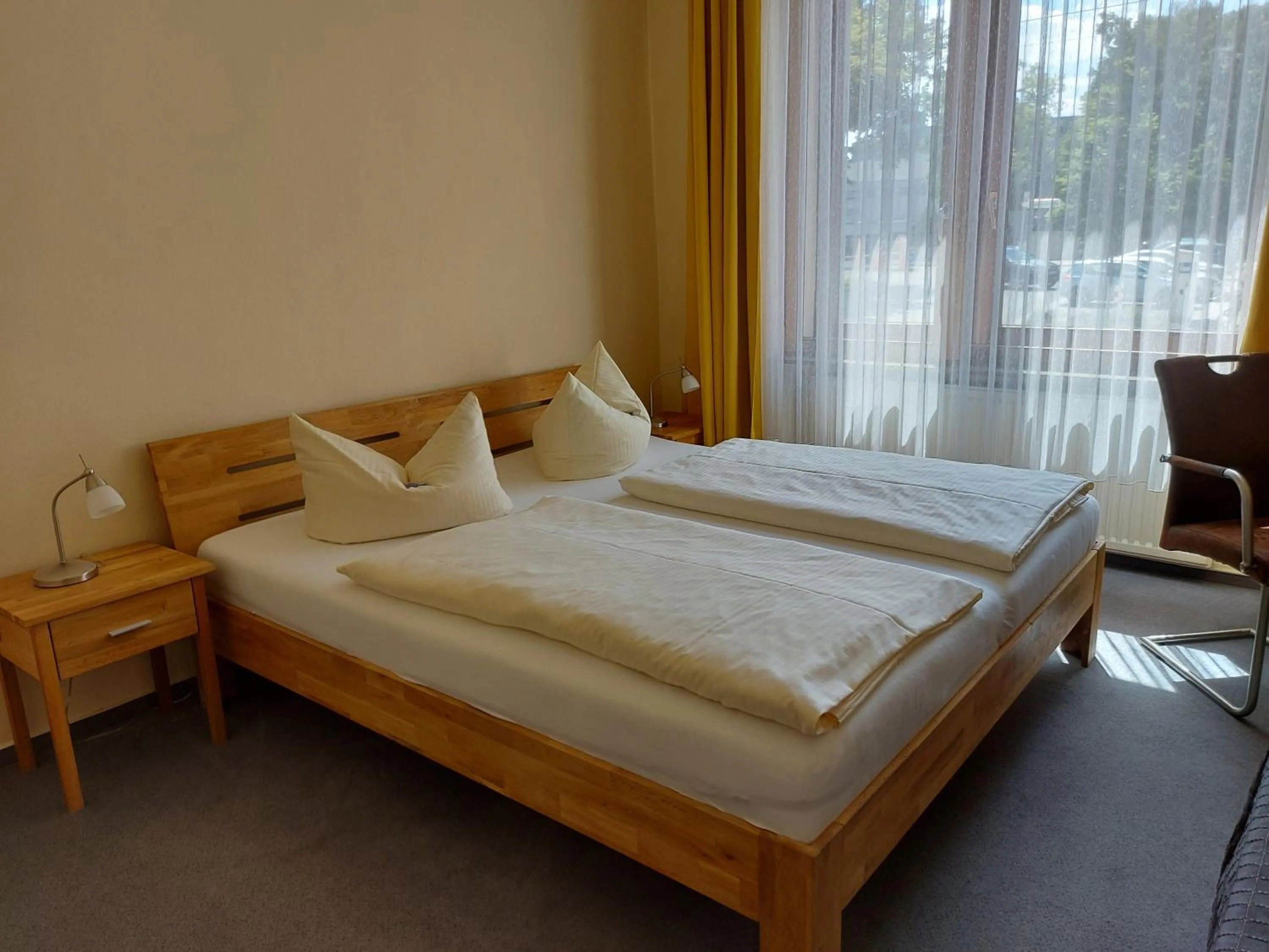 Photo of the whole room, Bed in An der Stadthalle