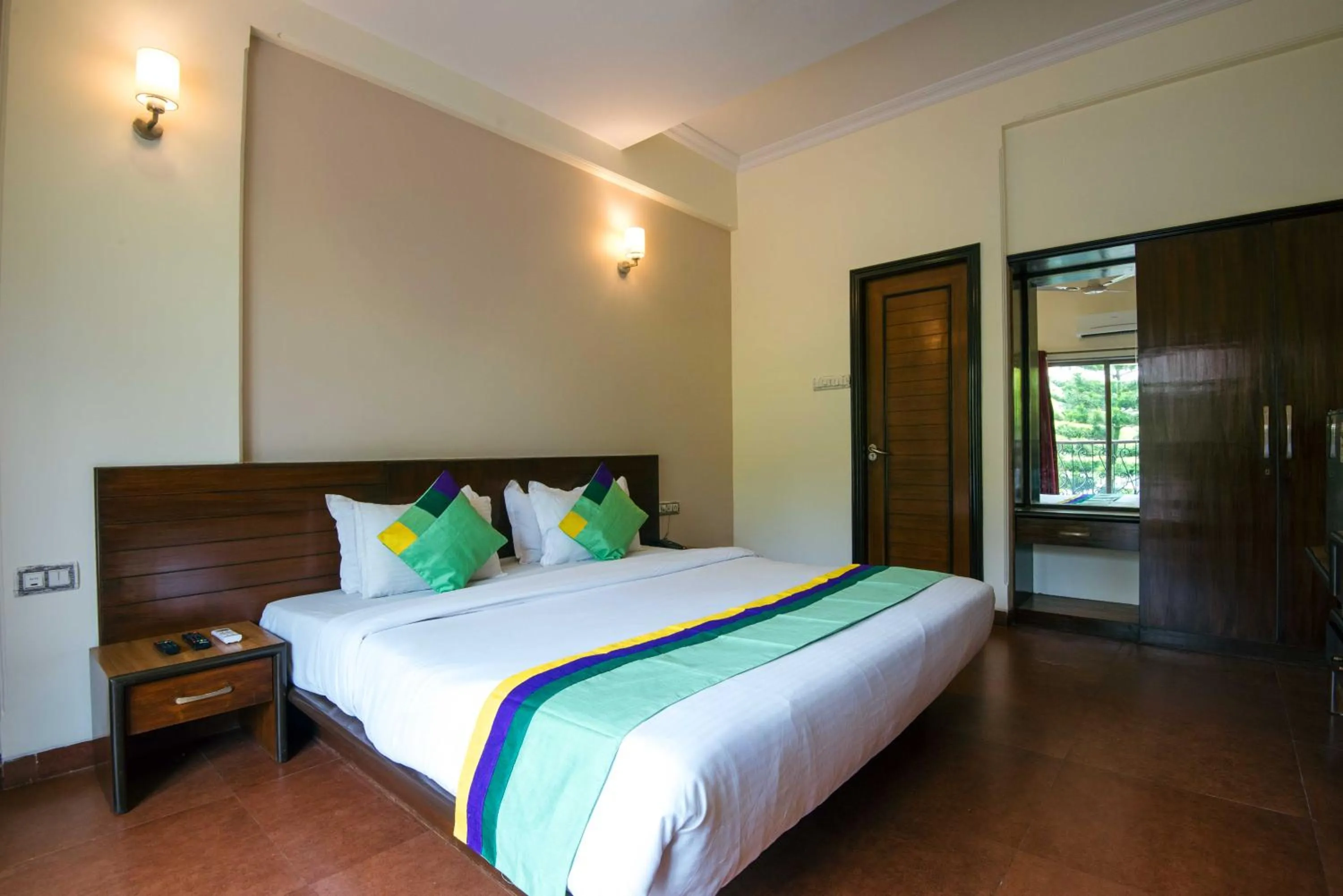 Bedroom, Bed in Treebo Reveniir Resort with Pool