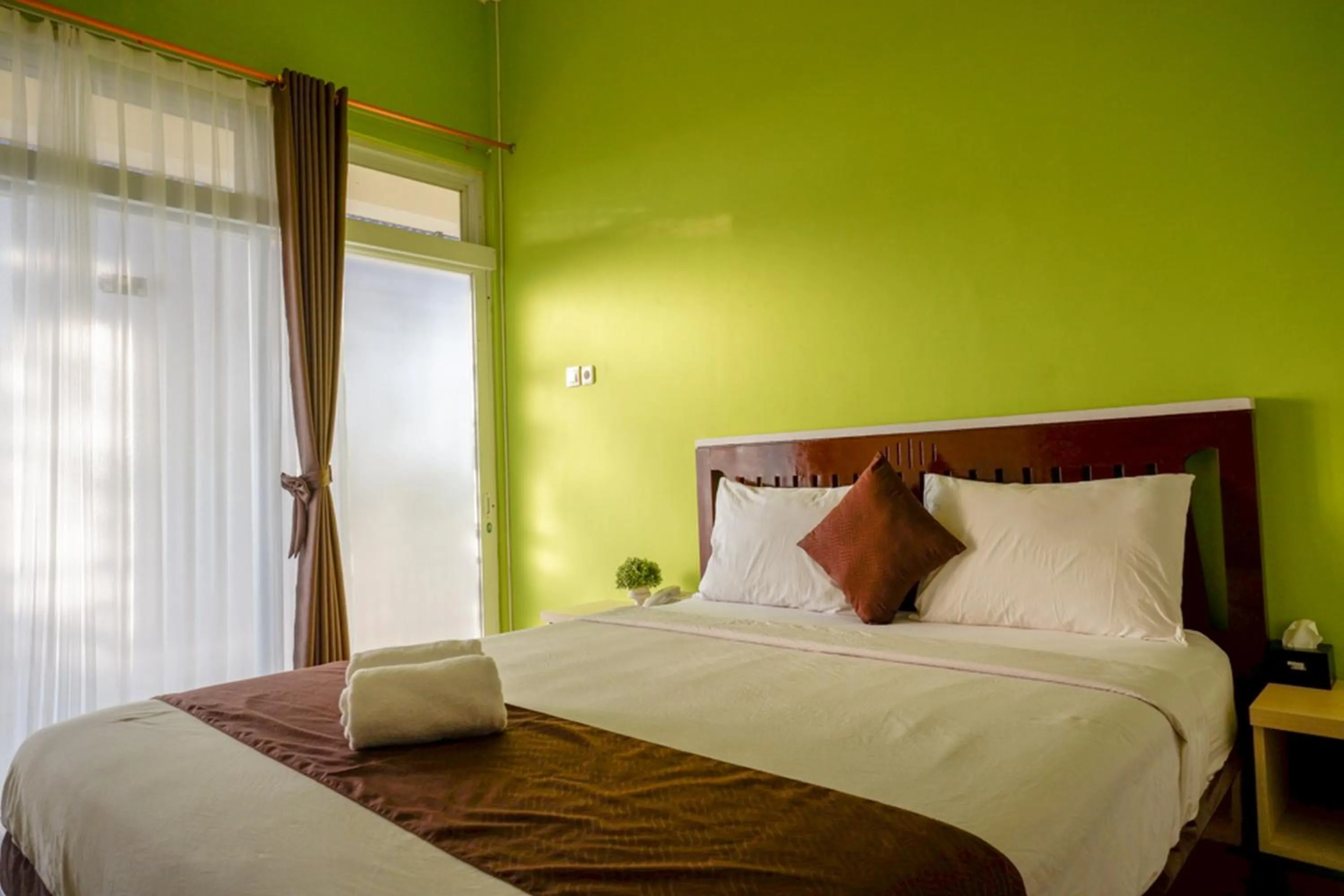 Bed in RedDoorz Syariah at Omah Sawah