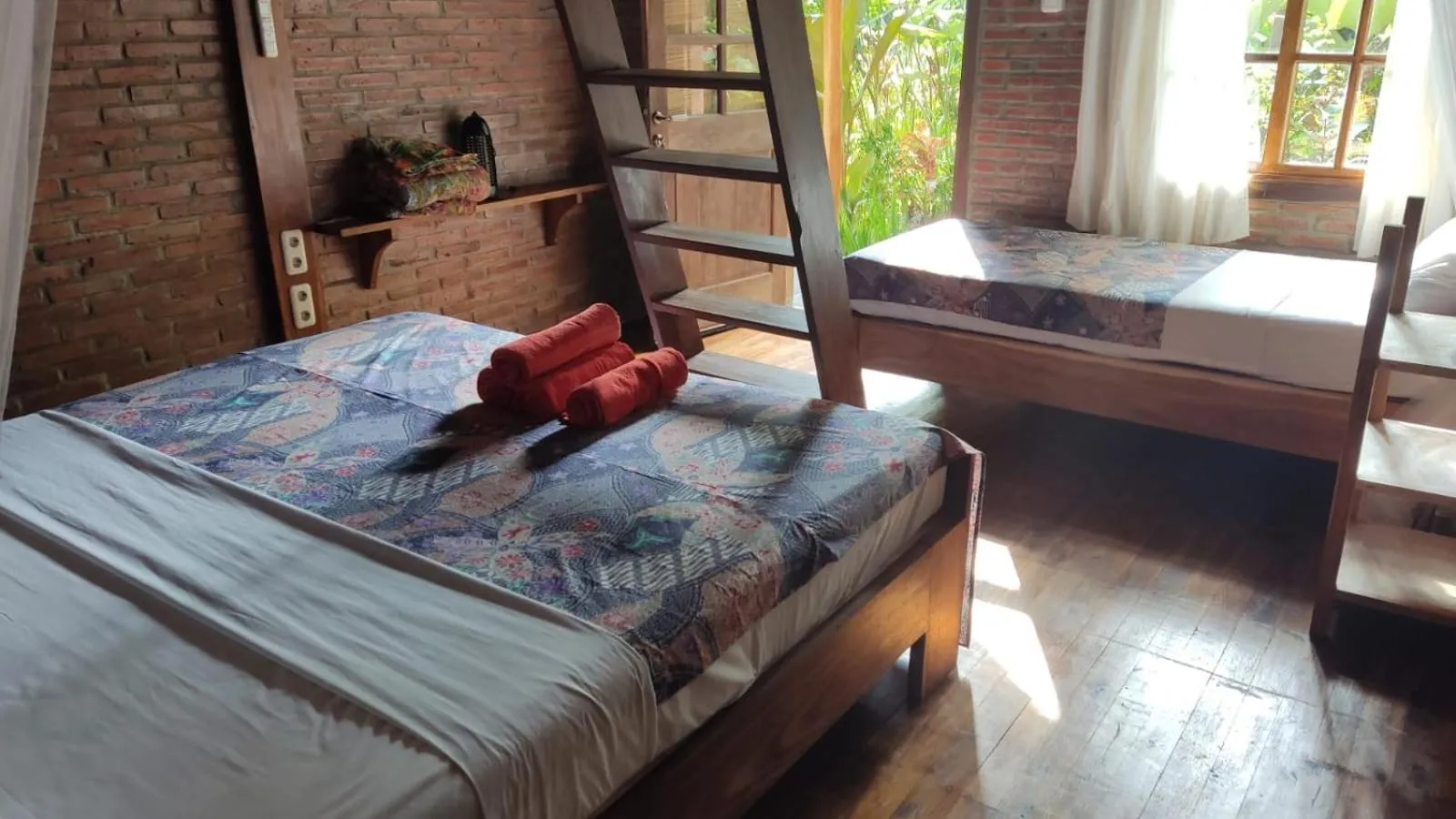 Bed in Coconut Tree Cottages