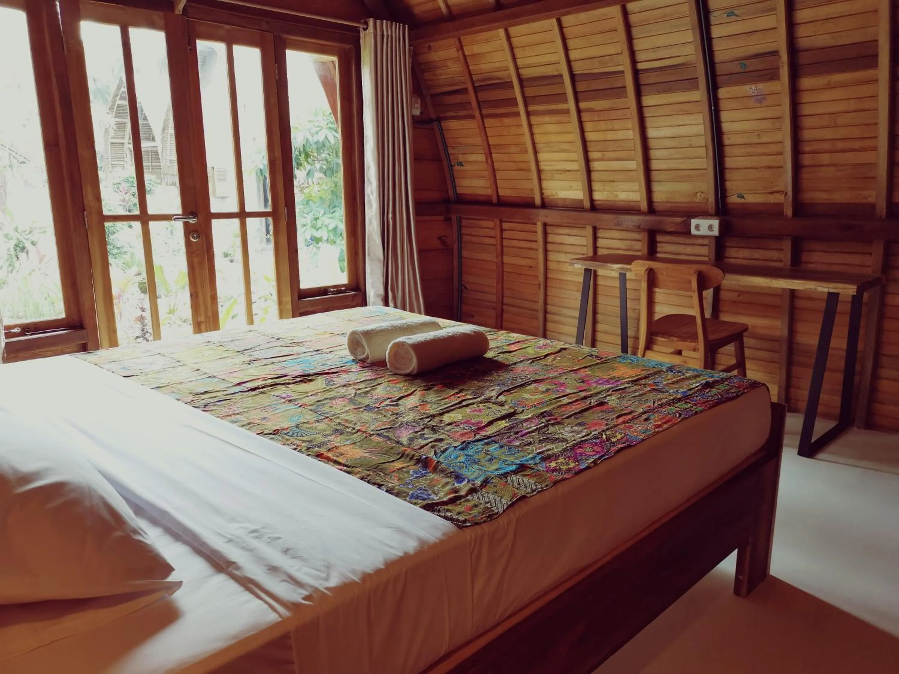 Bed in Coconut Tree Cottages