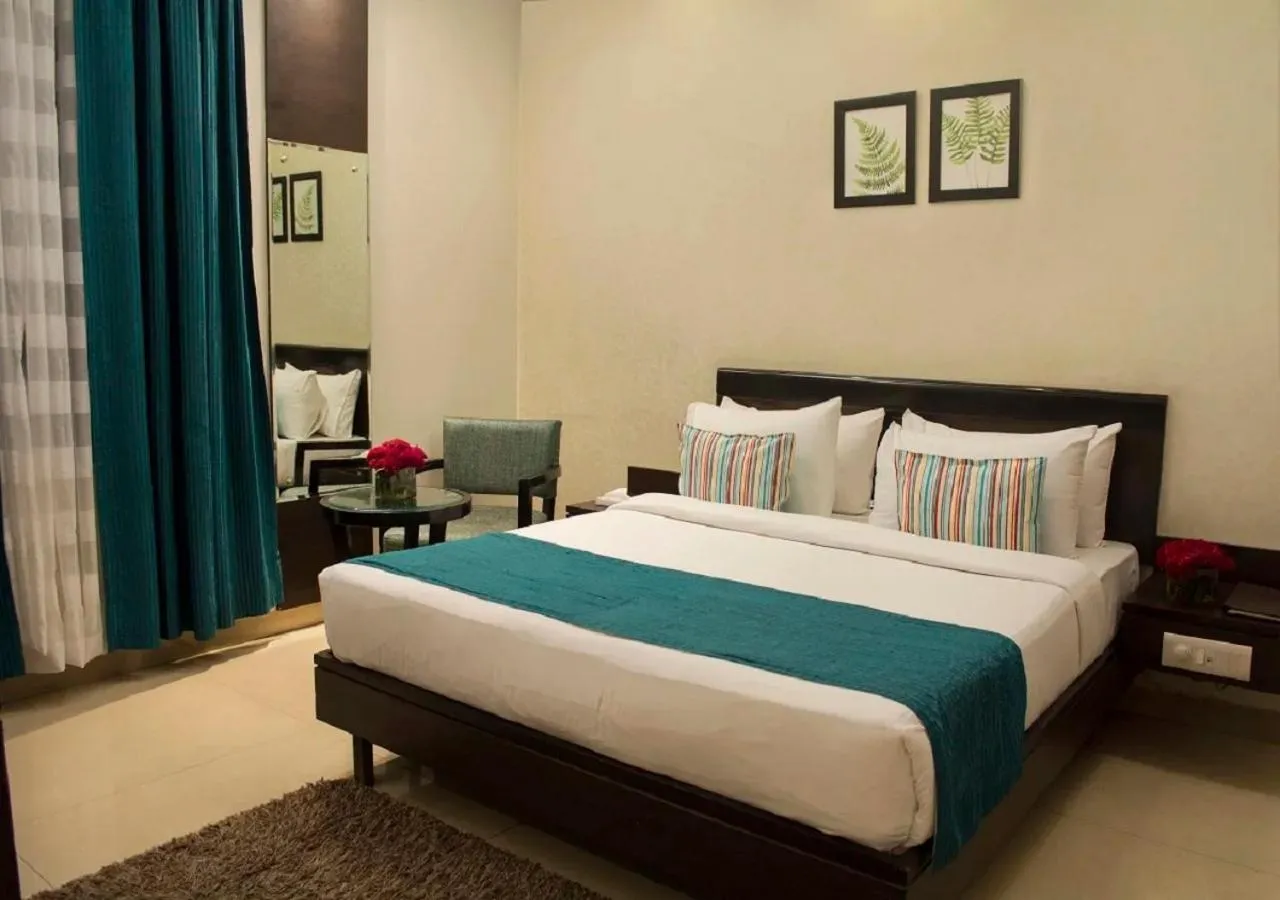 Bedroom, Bed in Hotel Rockland Panchsheel Enclave