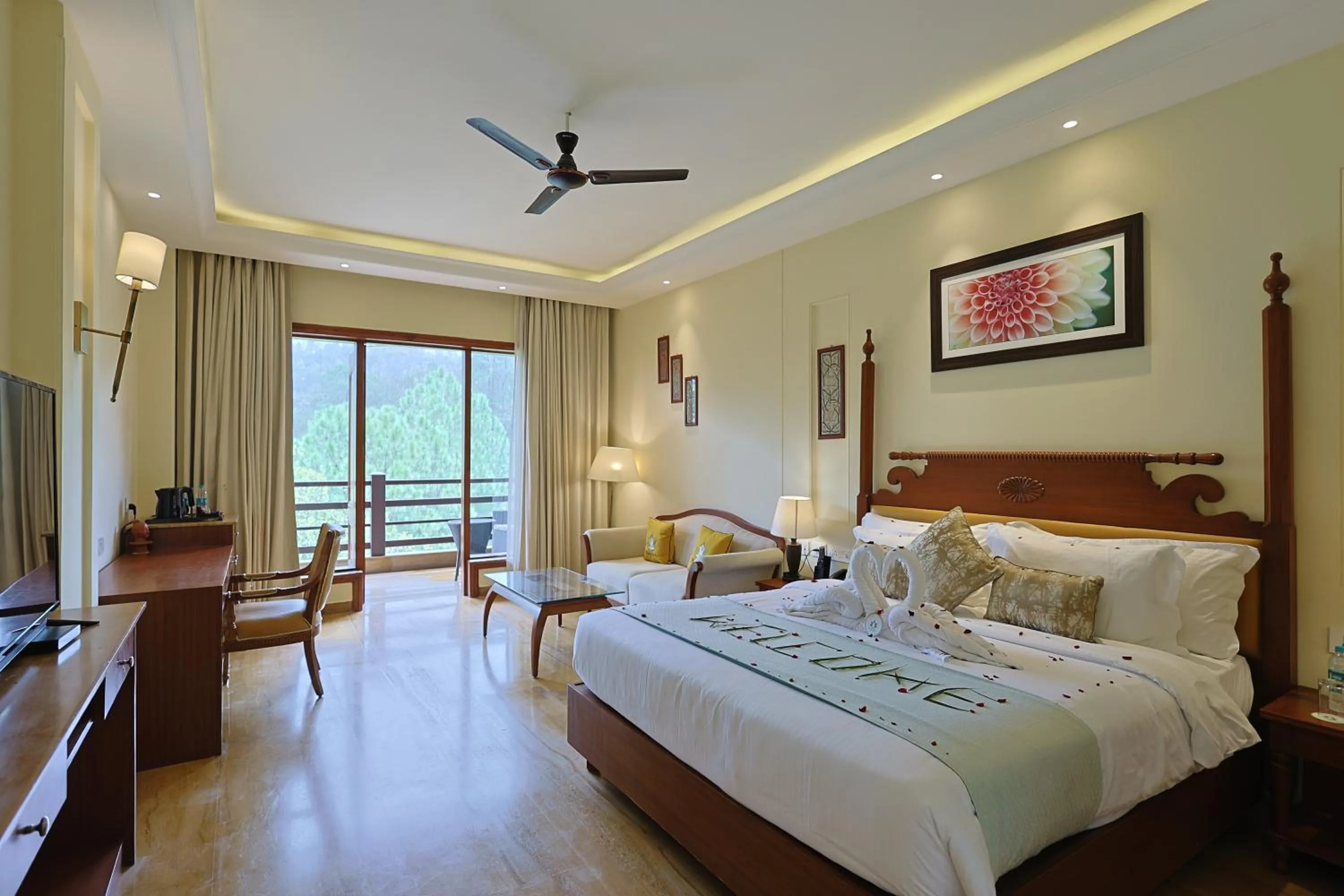 Communal lounge/ TV room, Bed in Punarnava Resort & Spa