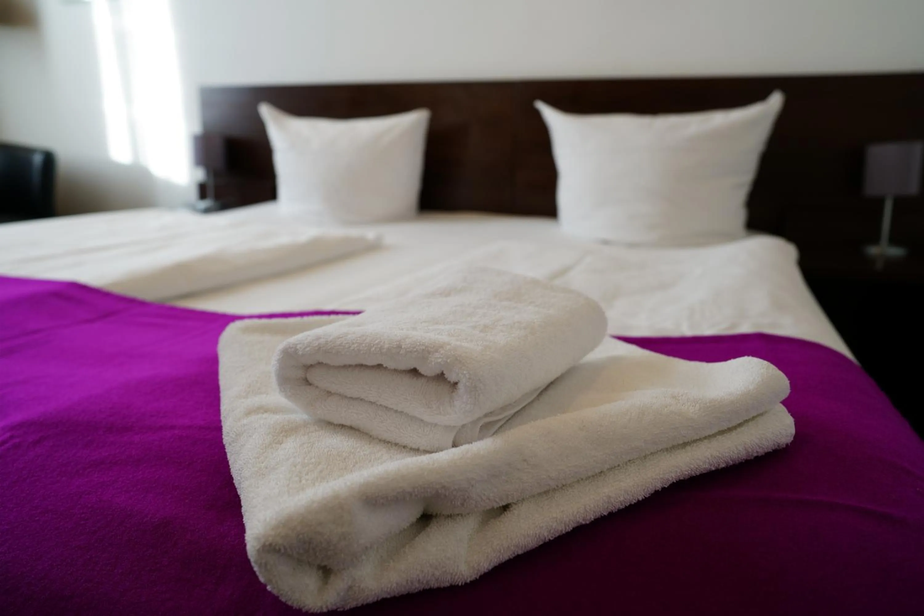 towels, Bed in Hotel Margrit