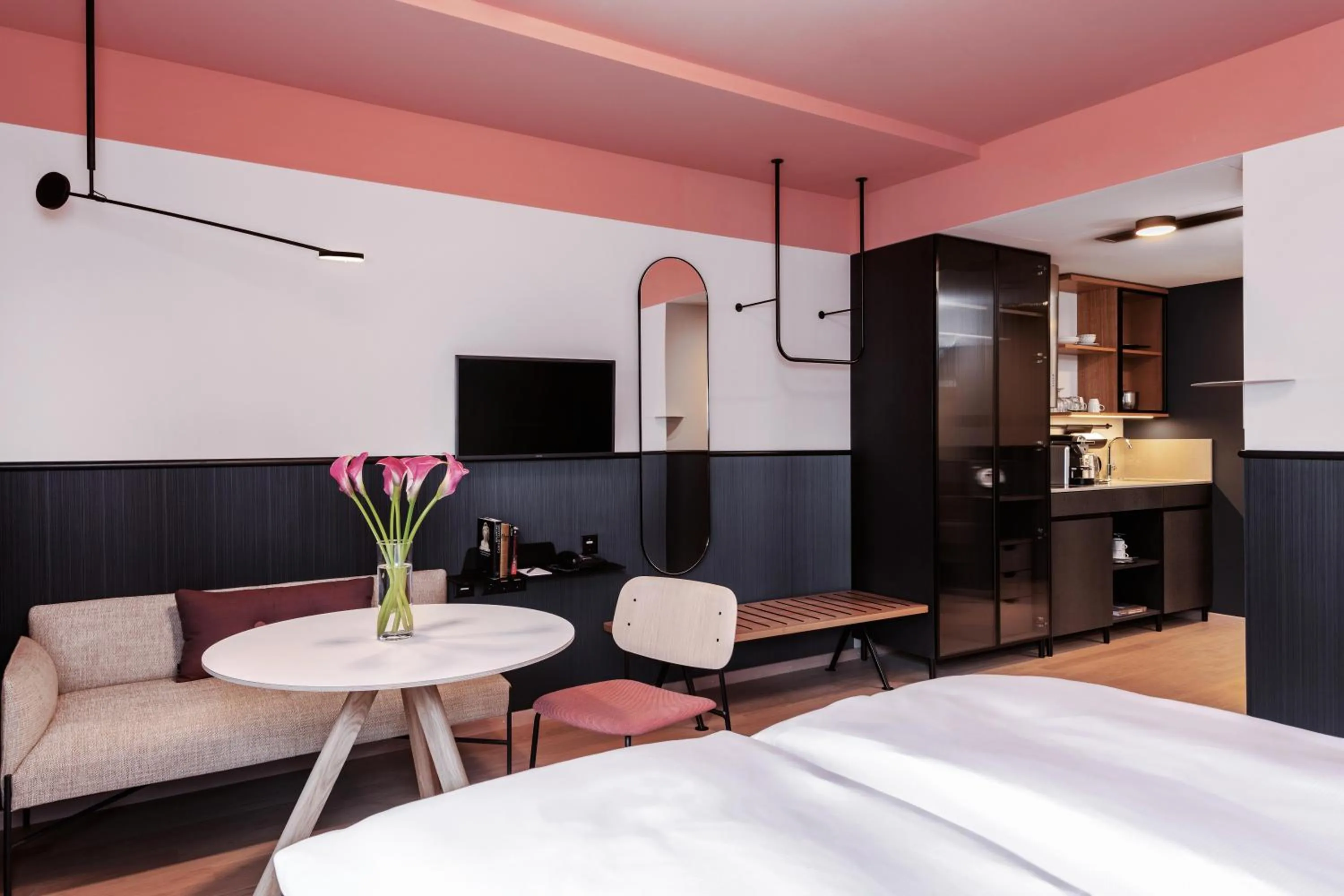 Kitchen or kitchenette, Bed in Sorell Boutique-Hotel City Weissenstein St Gallen